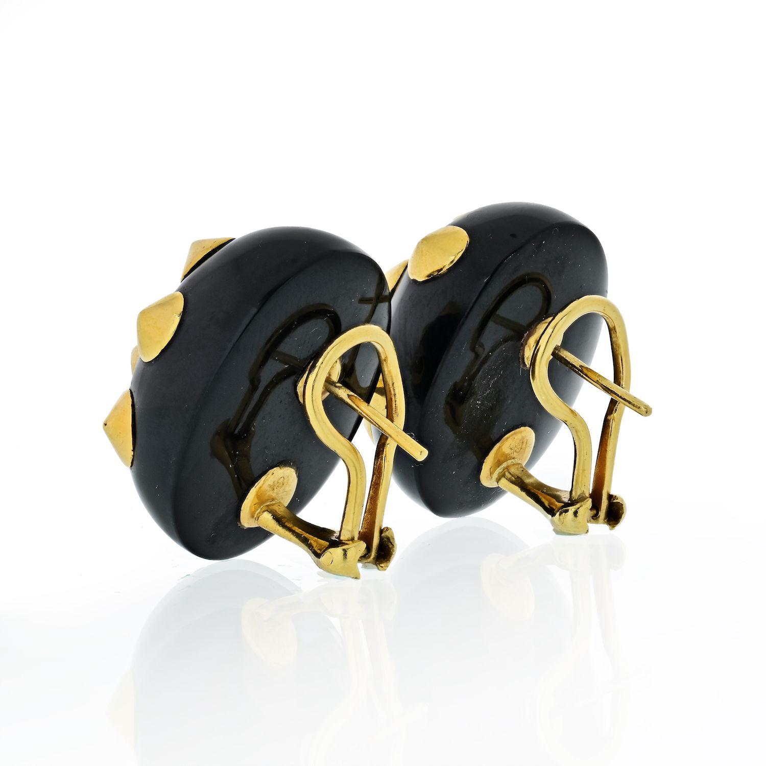 An iconic pair of 18k yellow gold earrings adorned with black jade. Crafted by famed designer Angela Cummings, the earrings measure 25mm x 21mm and weigh 26 grams.
Post backing for pierced ears. 
Each designed as a carved black jade half hoop set