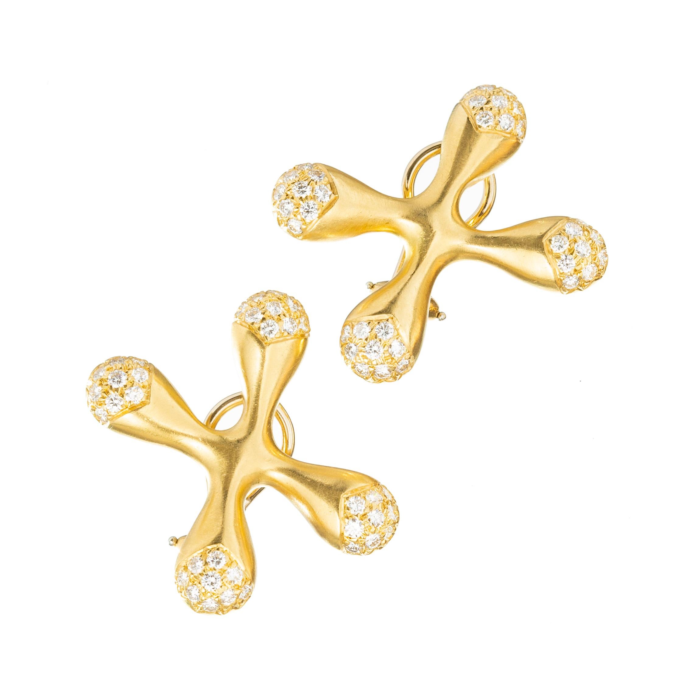 Angela Cummings 18k yellow gold and diamond accented 'X' design earrings. Matte finish with the tips accented by seventy-two round brilliant cut diamonds totaling 1.50 carats.  Pierced posts with omega style hinged clip backs.  Overall Length: 1.2