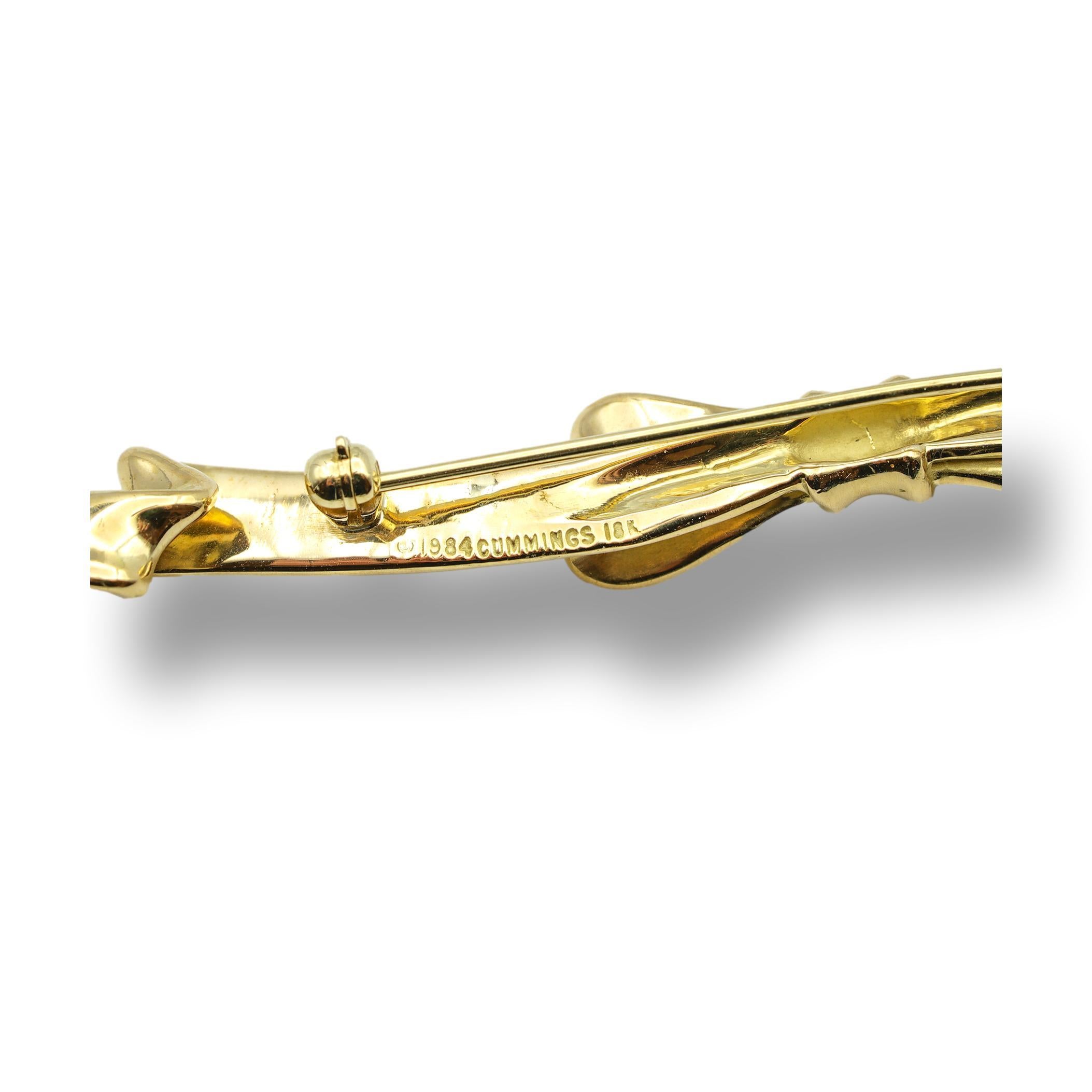 Vintage 18 Karat Gold Bow pin designed by Angela Cummings from her 1984 collection. Front of the pin has a satin finish and the back has a high polished gold finish. This pin has a nice substantial heft to it, with a very silky feel. Fully