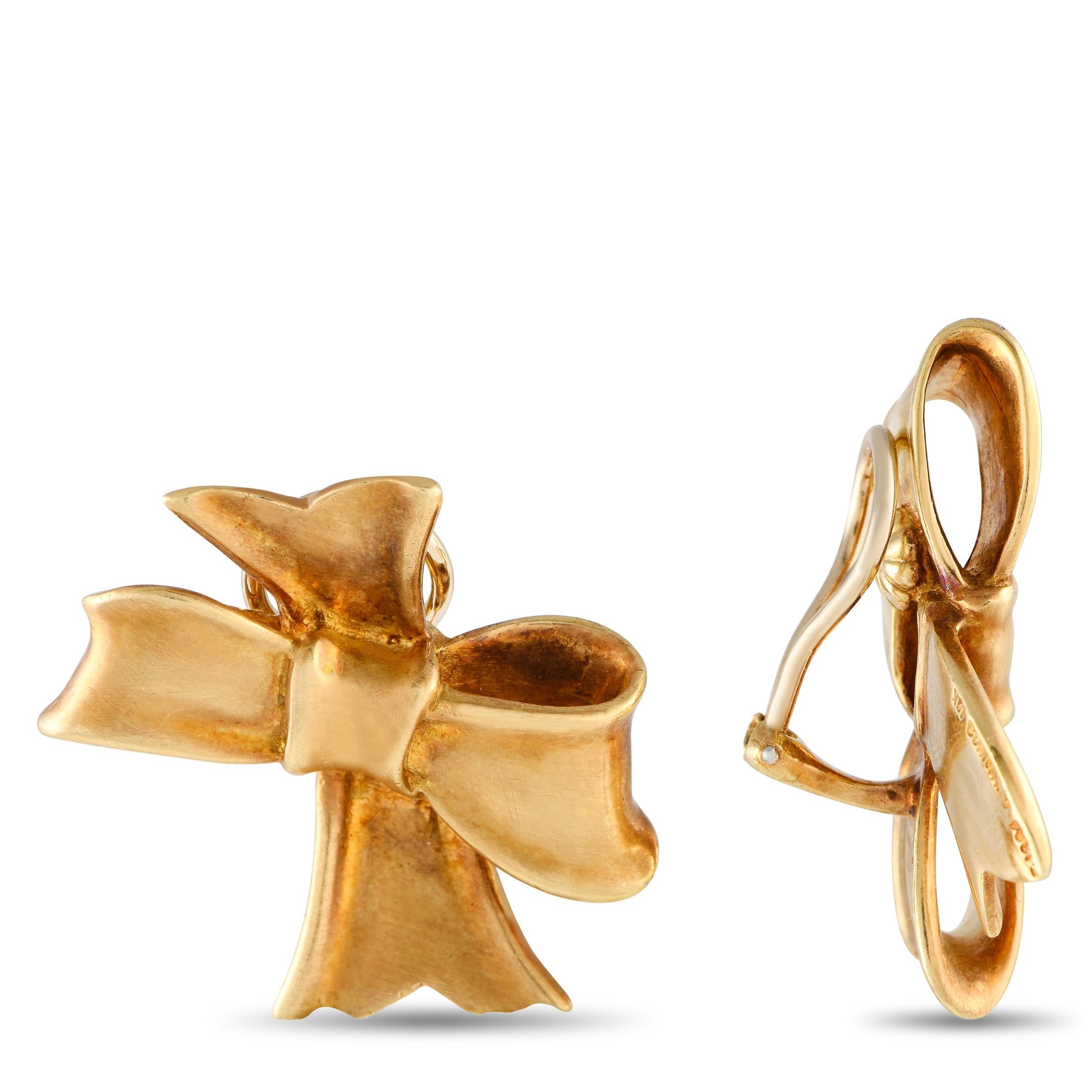 Put the perfect finishing touch on any outfit with these charming Angela Cummings Bow earrings. Opulent 18K Yellow Gold makes them a luxurious addition to any ensemble. Complete with clip-on closure, each one measures 1.5 long by 1.0 wide.This