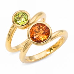 Angela Cummings: anelli intrecciati sovrapponibili in oro giallo 18k con peridoto e citrino