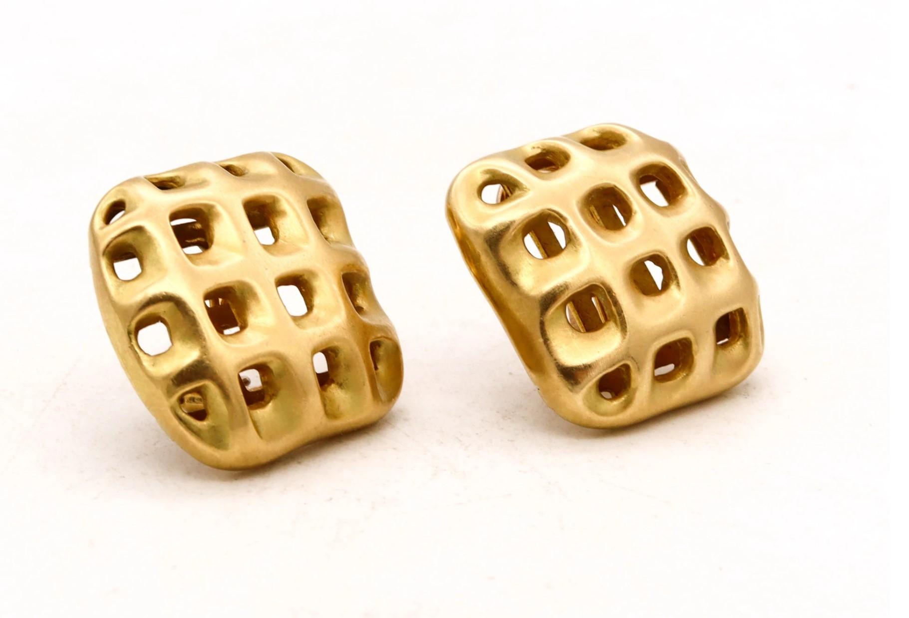 Pair of earrings designed by Angela Cummings.

Great three-dimensional sculptural pieces, created by Cummings at her New York studio, back in the 1987. This pair of earrings has been designed, with an intricate patterns of perforations, carefully