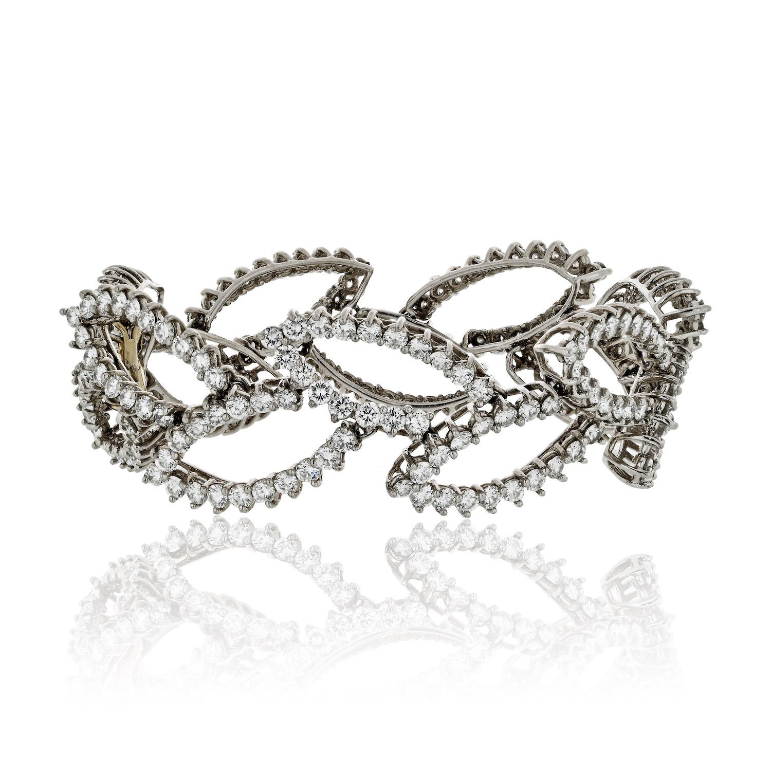 Experience the epitome of luxury with the Angela Cummings Platinum Round Diamond Cloud Bracelet, boasting an impressive total carat weight of 26.00cttw. Crafted with meticulous attention to detail, this exquisite piece showcases a unique design