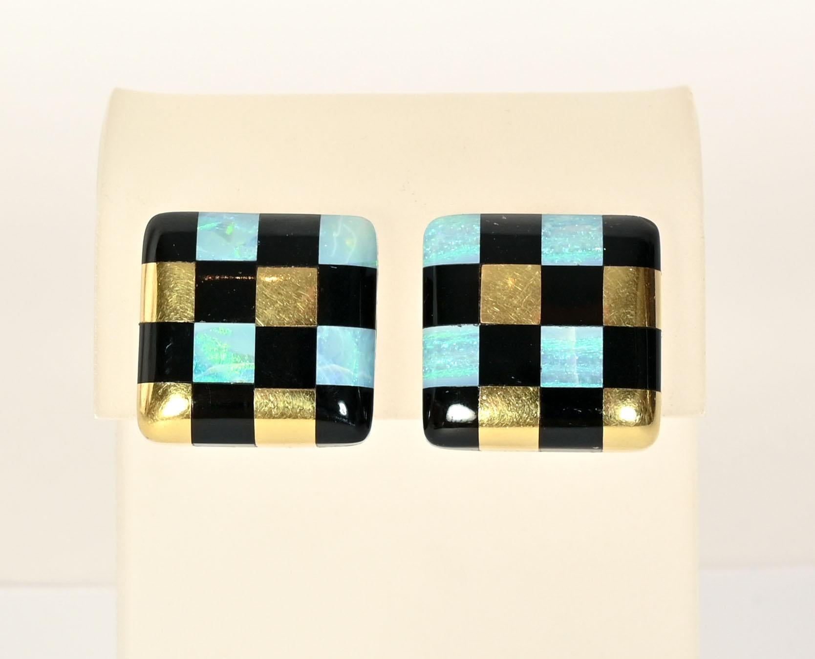 Angela Cummings checkerboard earrings of black onyx and black opal. Sixteen squares alternate the stones with gold. The earrings are dated 1982. Backs are clips that can be converted to posts, The earrings measure 7/8' in width and length.