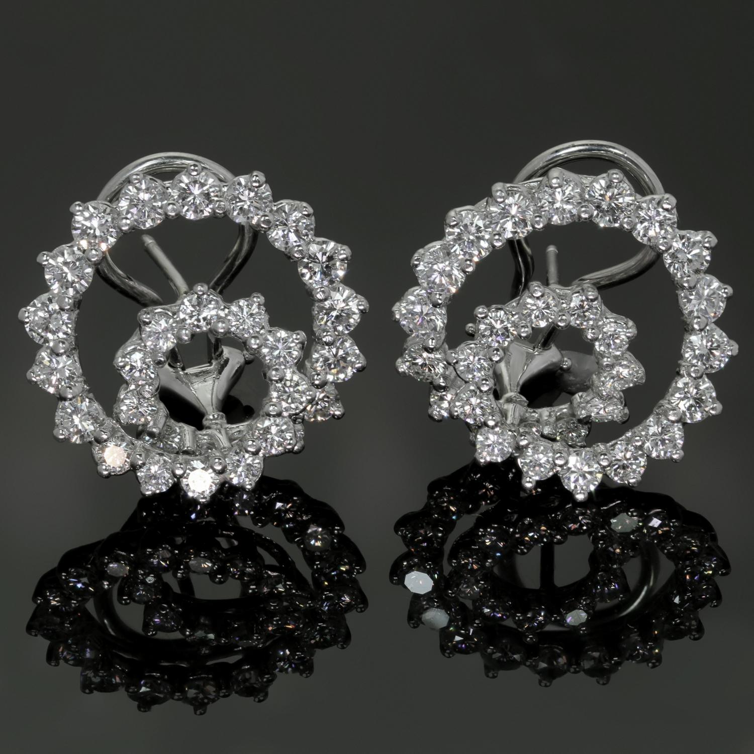 These gorgeous Angela Cummings earrings feature a swirling spiral design crafted in platinum and set with approximately 58 brilliant-cut round diamonds weighing an estimated 3.8 - 4.0 carats. These are the large model. Made in United States circa