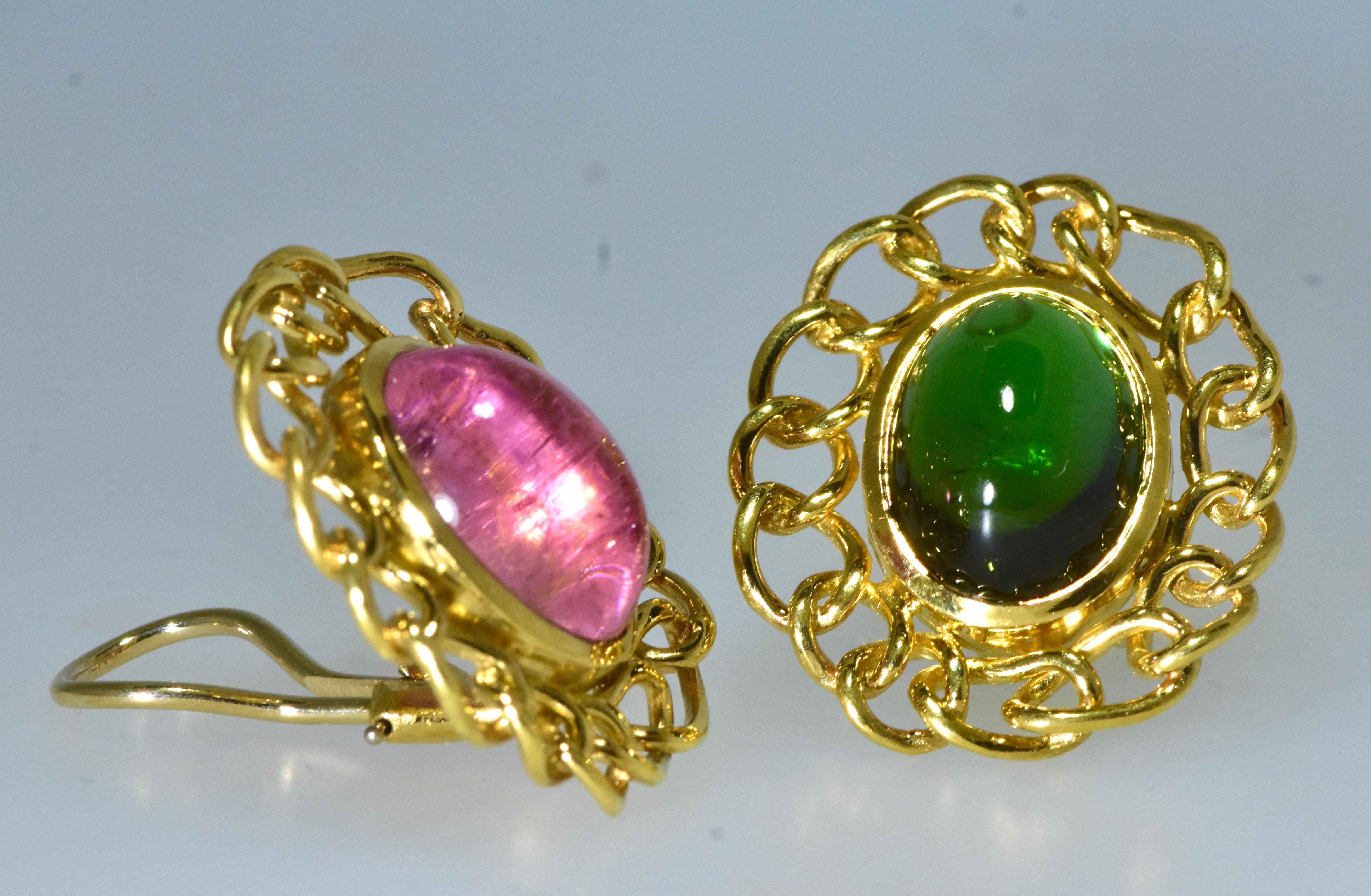 Angela Cummings 18K earrings with green and pink tourmalines.  The bright green and bright pink cabochon oval stones are estimated to each weigh 7.0 cts.  These 14 cts. of tourmaline are surrounded by a frame of 18K gold links.  The earrings are now