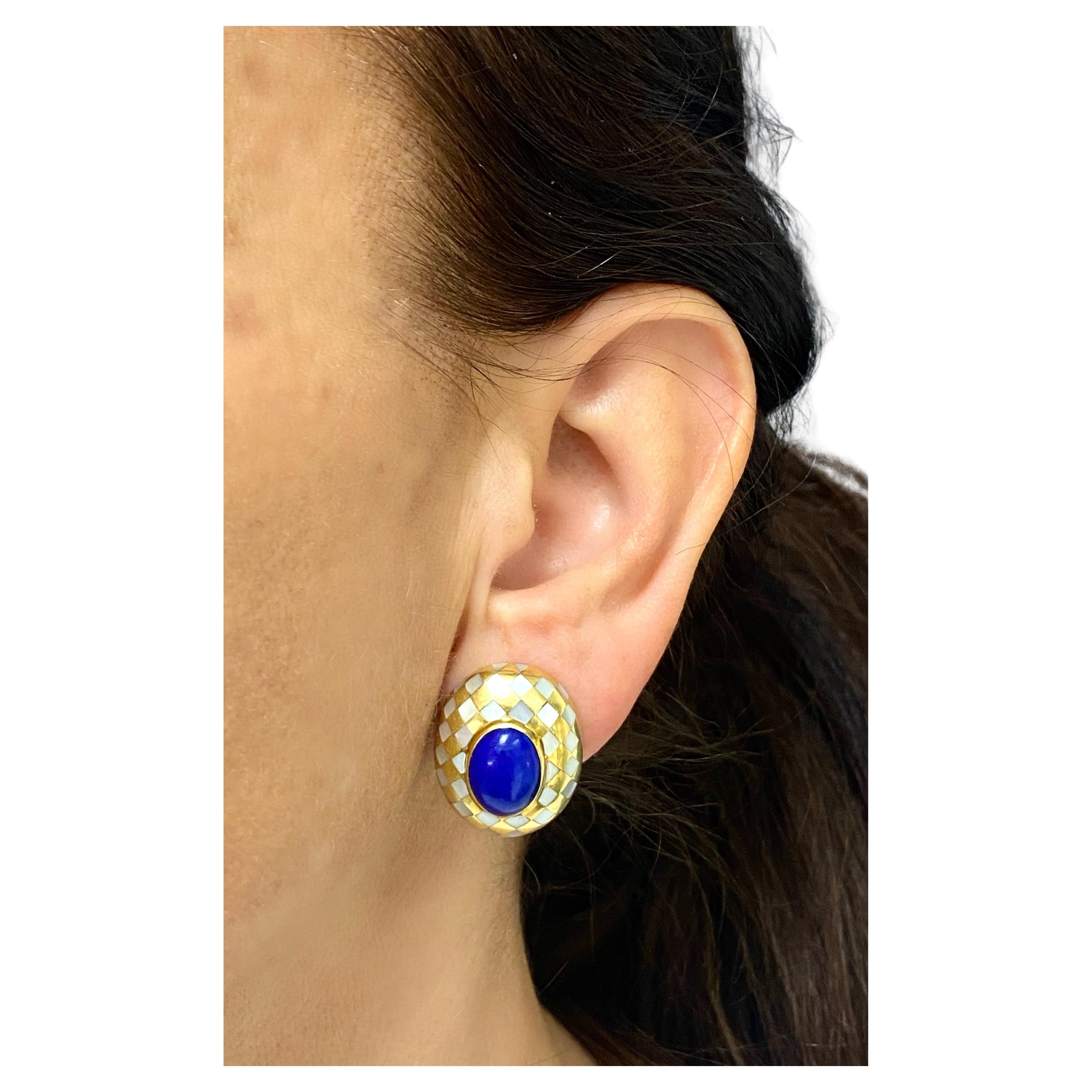 DESIGNER: Angela Cummings
CIRCA: 1984
MATERIALS: 18k Yellow Gold
GEMSTONE: Lapis Lazuli
GEMSTONE 2: Mother of Pearl Inlay
WEIGHT: 21.6 grams
MEASUREMENTS: 1” x 3/4”
HALLMARKS: Angela Cummings, 18K, 1984

ITEM DETAILS:
A pair of vintage earrings by