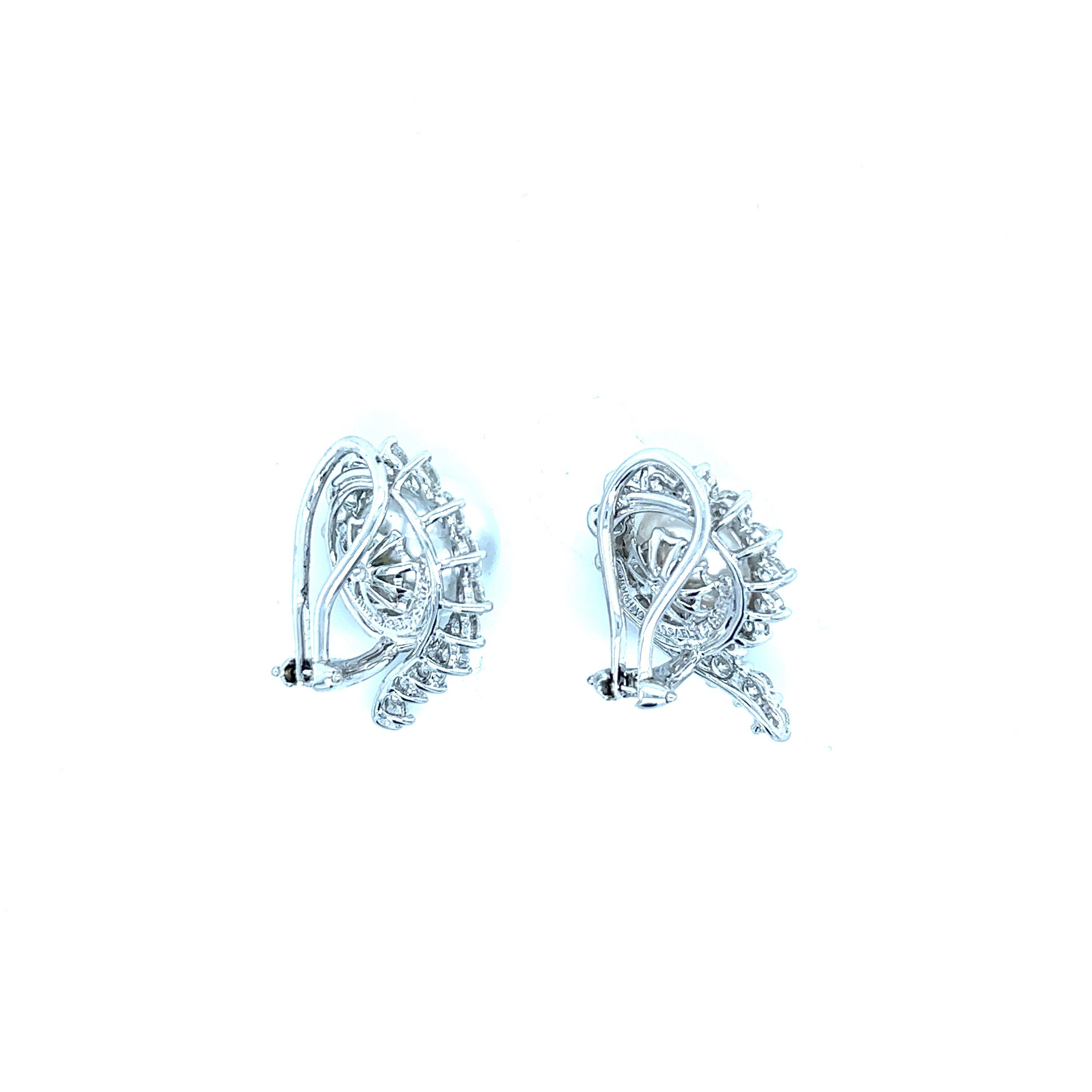 Angela Cummings for Assael 18 karat white gold and platinum ear clips with pearls and diamonds. The pearl's diameter is 1.1 cm. The beautiful, white diamonds weigh approximately 3 carats. Marked: Cummings / Assael / Plat 950 / 750. Total weight: