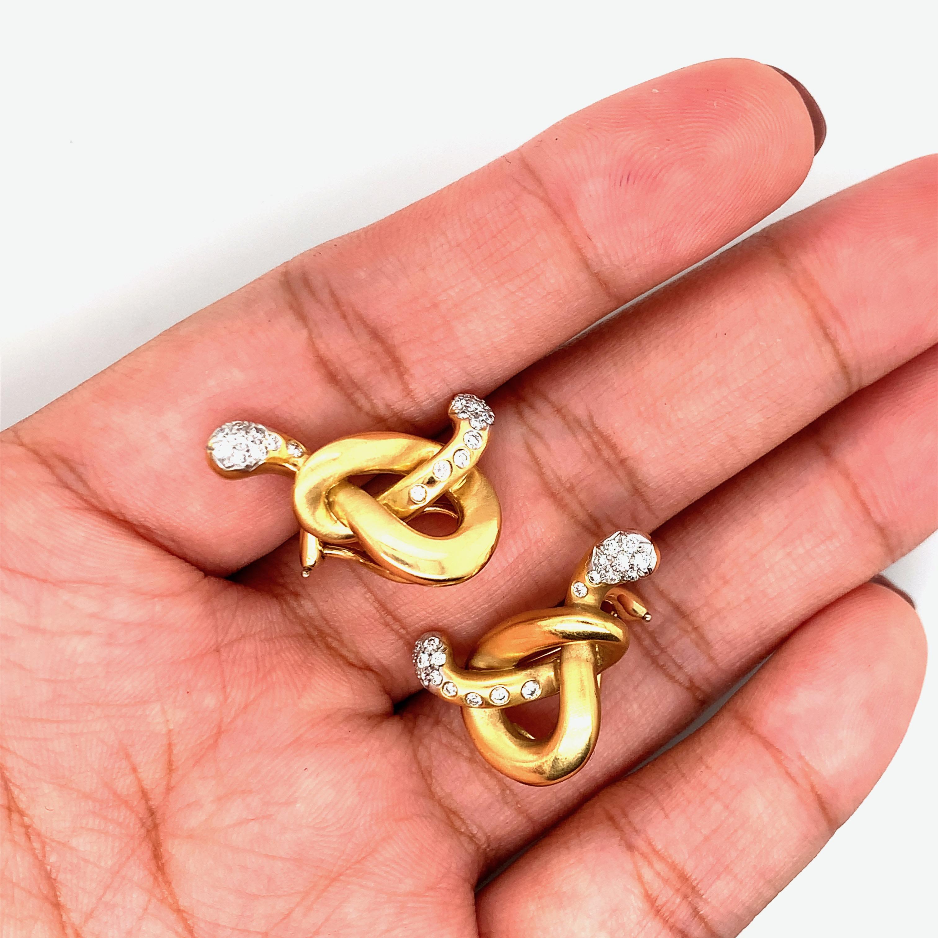 Angela Cummings for Assael 18 karat yellow gold earrings , featuring pretzel knot design, set with approx. 0.38ctw G/VS diamonds.  Marked: Cummings / Assael / 750. Total weight: 16.1 grams.  Earrings measure 1