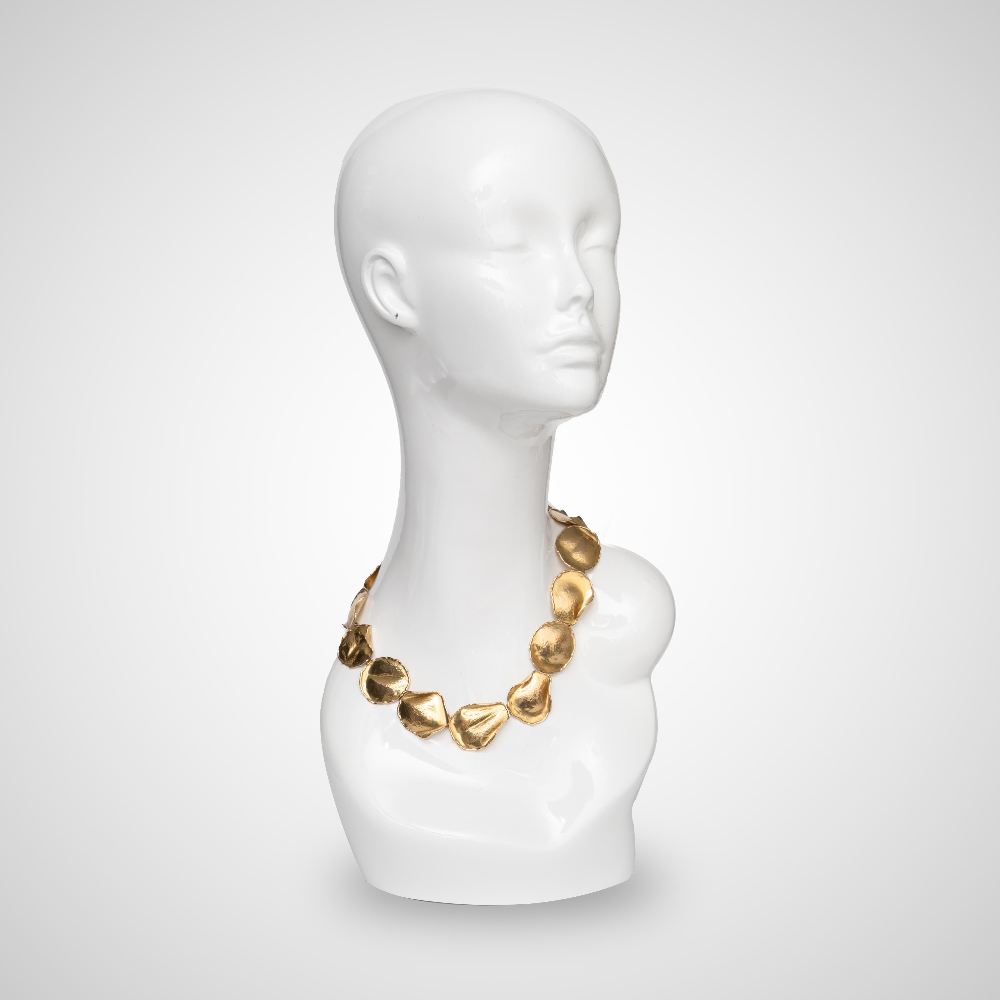 A 18k gold Angela Cummings 1979 rose petal Tiffany and Co necklace. The necklace weighs 63.5g. Length 19