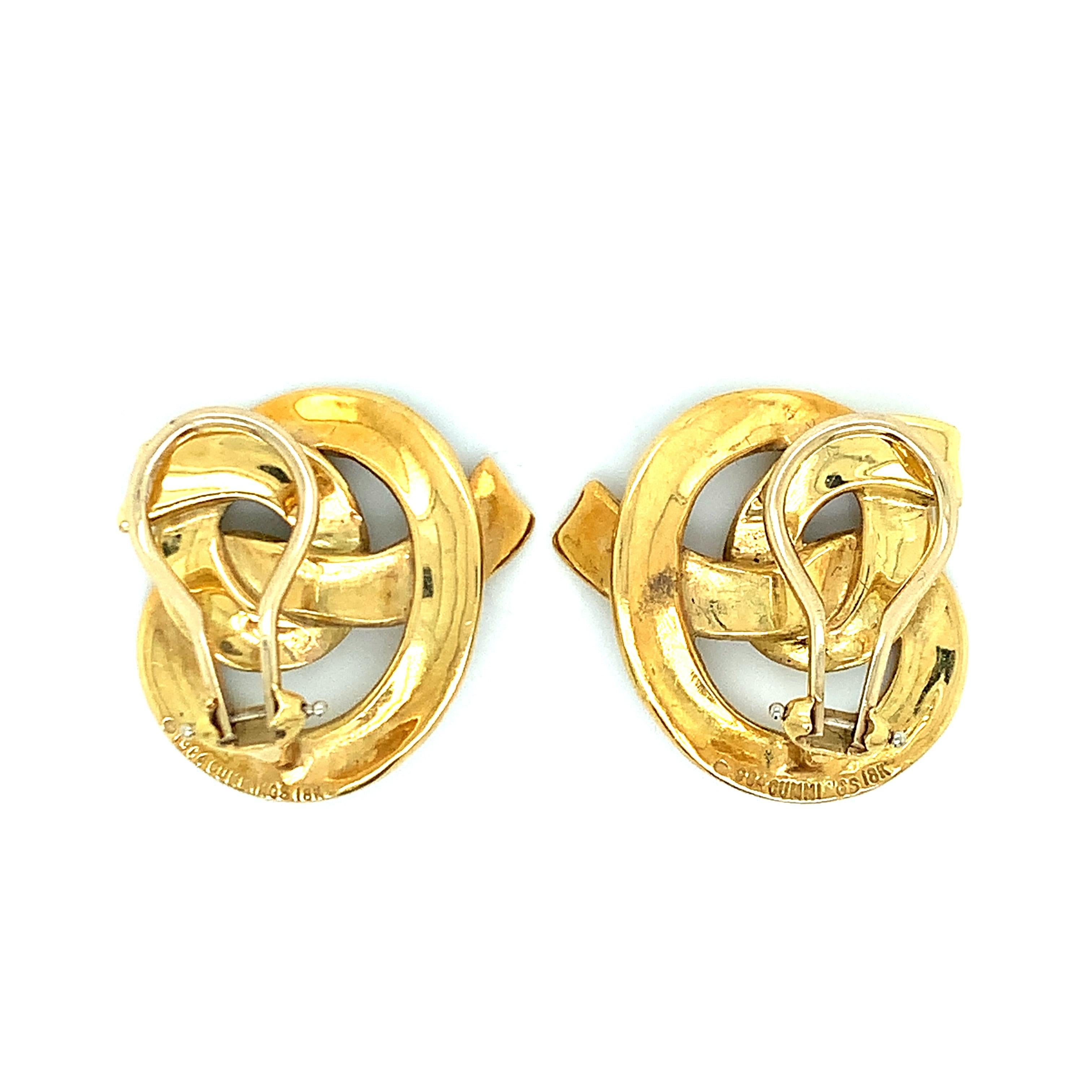 Angela Cummings for Tiffany & Co. 18 karat yellow gold ear clips that feature a swirl motif. Marked: 1984 / Cummings / 18K. Total weight: 15.9 grams. Width: 2.4 cm. Length: 2.3 cm. 