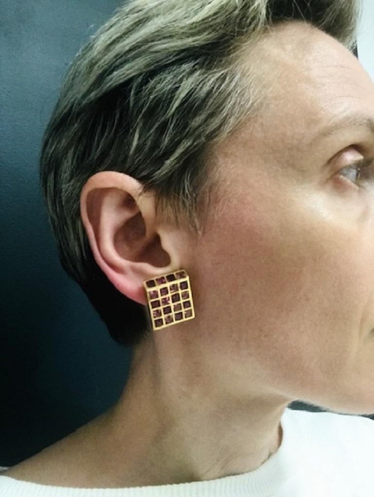 An amazing pair of Angela Cummings for Tiffany & Co. tourmaline 18k gold square shape earrings. The gems are caliber-cut. 
Squares and checkered patterns were the most favorite motifs for Angela Cummings to play with. In these earrings, bezel-set