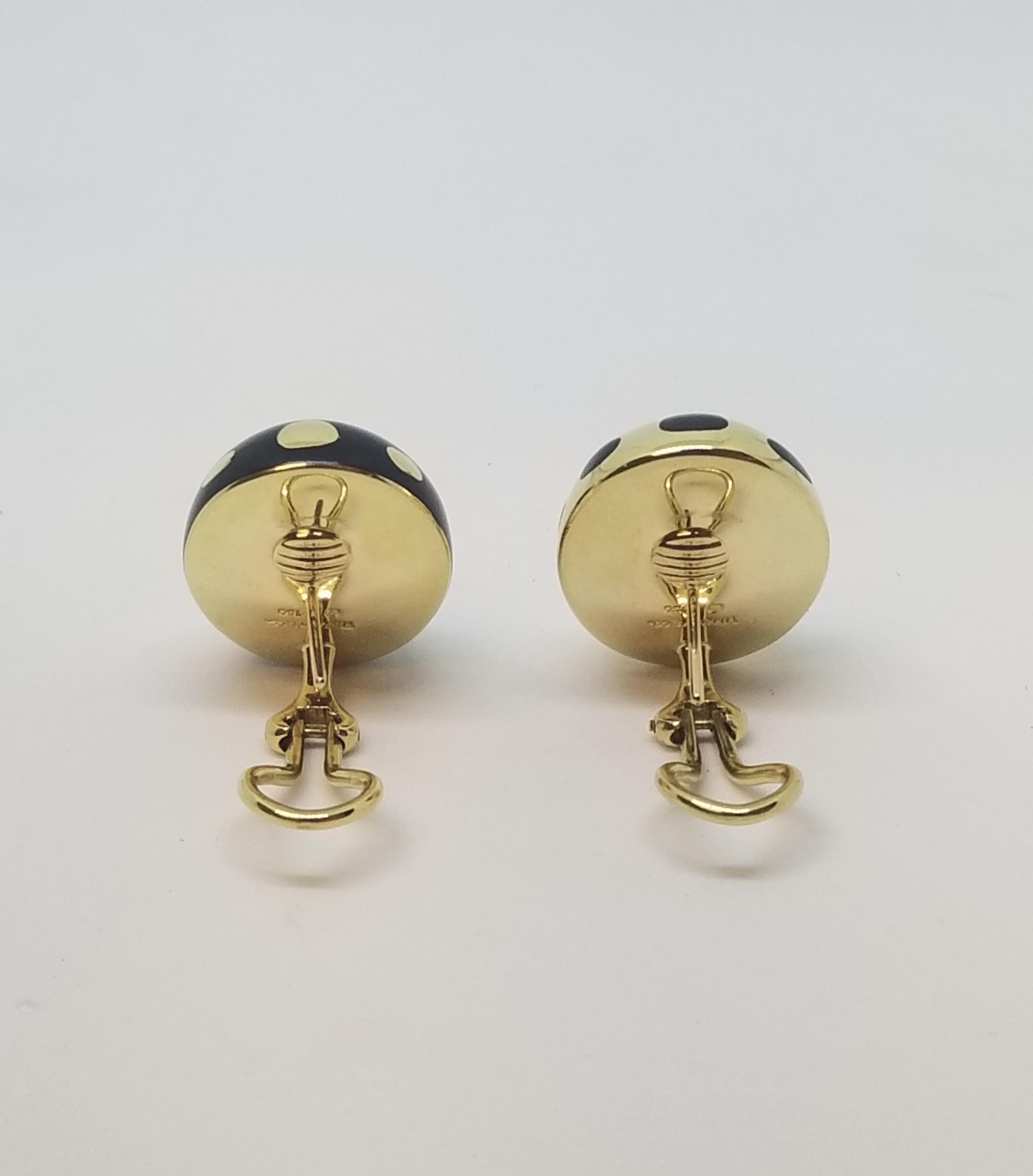 Strikingly handsome these egg shaped Angela Cummings for Tiffany & Co 18 karat yellow gold and black jade earrings are a must have wardrobe accessory.  With a black and gold positive/negative organic dot design, the circa 2000 earrings are a