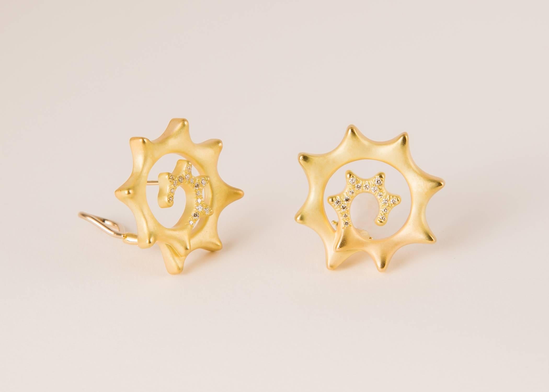 Angela Cummings creates a playful easy to wear earring with just a touch of brilliant cut diamonds. One inch in size. 