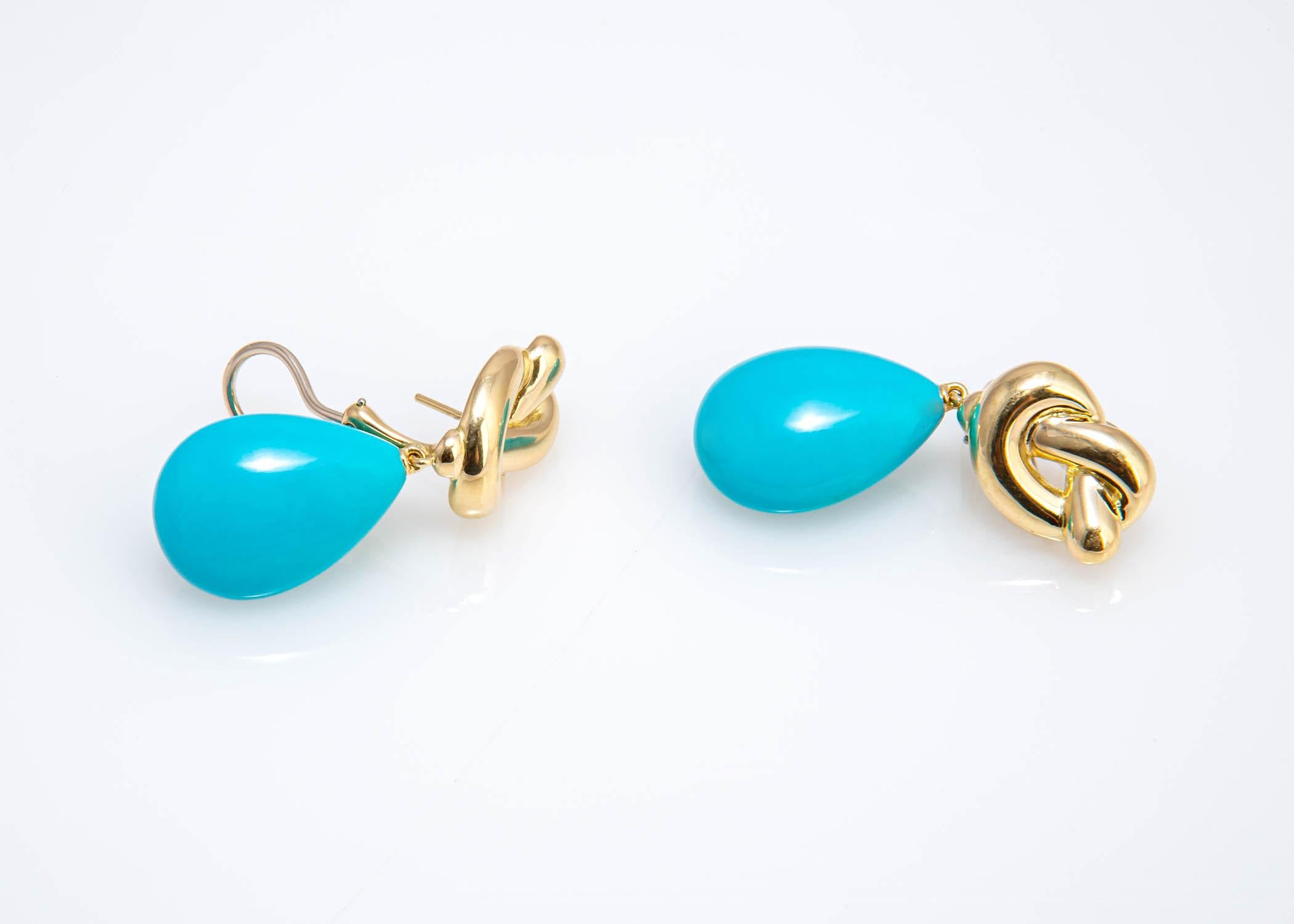 Angela Cummings began her career with Tiffany & Co. in 1968 and left to begin her own company in 1984. This pair of drop turquoise earrings is a great example of her attraction to colored stones. This earring was created in 1982 and is signed