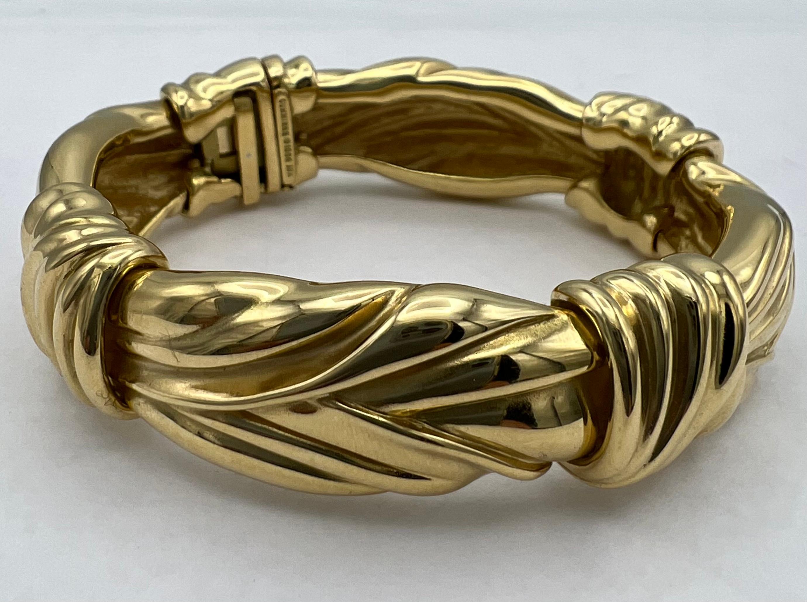 DESIGNER: Angela Cummings
CIRCA: 1984
MATERIALS: 18k Yellow Gold
WEIGHT: 90.3 grams
MEASUREMENTS: 6” x 11/16”
ITEM DETAILS:
​A glossy Angela Cummings 18k gold bangle bracelet. Stamped with the year of production (1984).​

​It is no exaggeration to