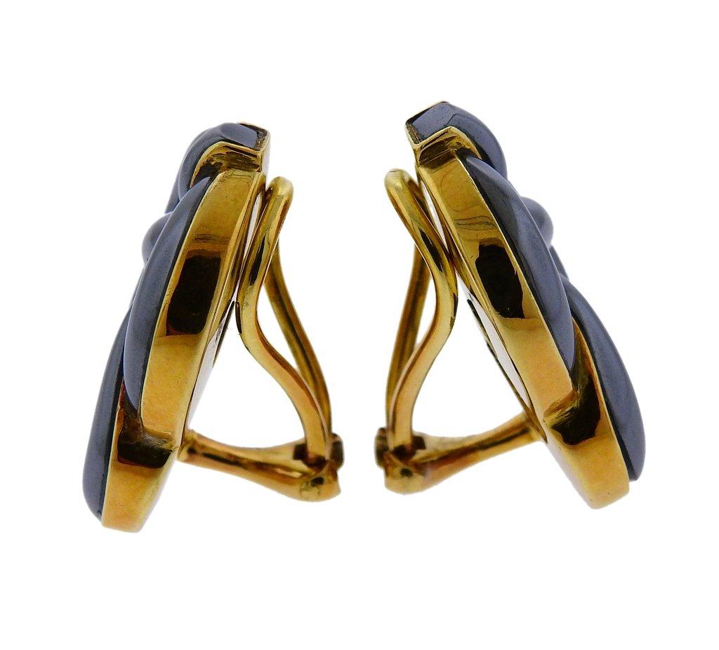 Circa 1982 vintage 18k yellow gold Celtic knot earrings by Angela Cummings, set with hematite. Earrings are 25mm x 21mm and weigh 29.2 grams. Marked Angela Cummings, 18kt, 1982.
