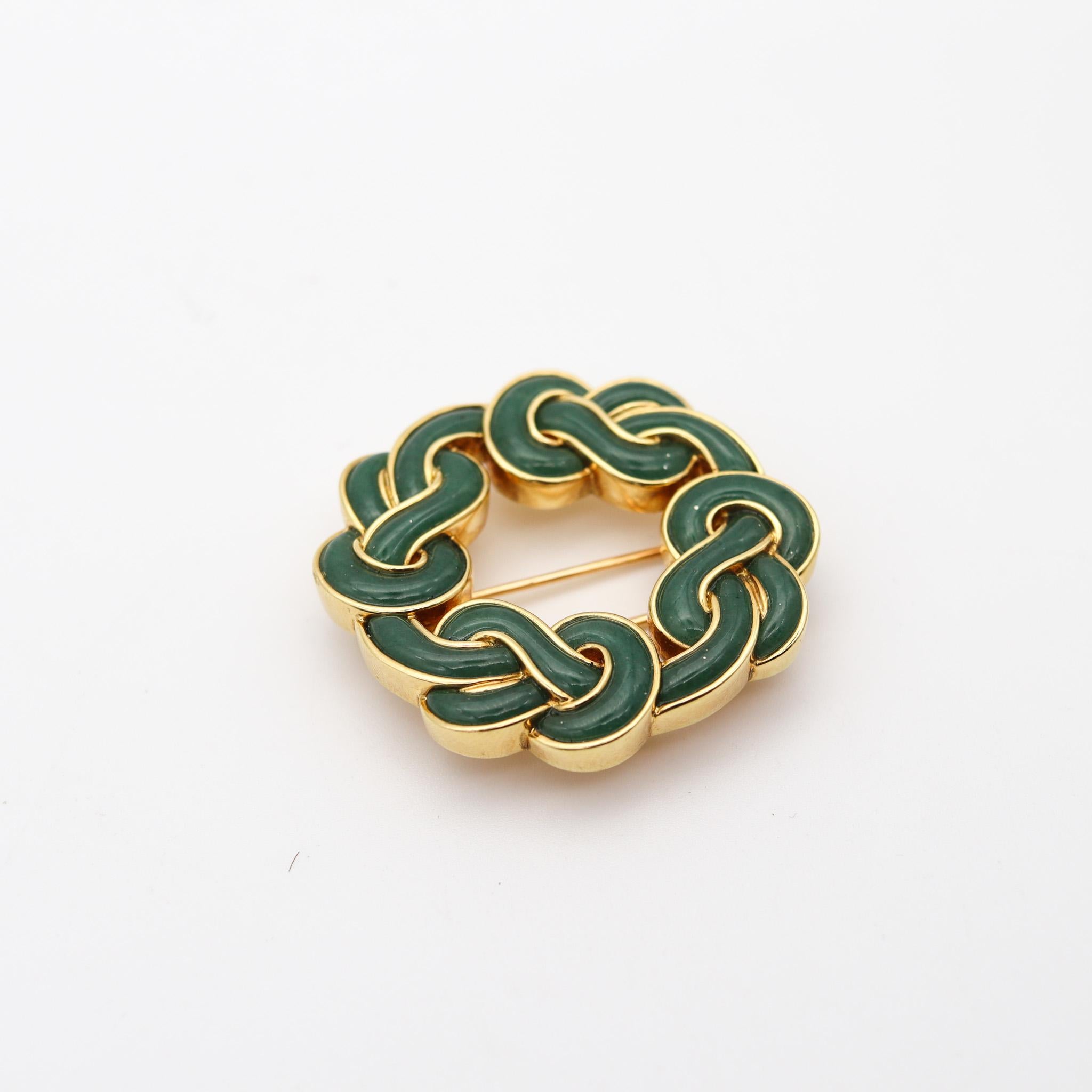 Infinite knots brooch designed by Angela Cummings.

This is a beautiful vintage brooch, created in New Yor City by Angela Cummings back in 1985. The brooch has been carefully crafted in the shape of infinite knots  in solid yellow gold of 18 karats