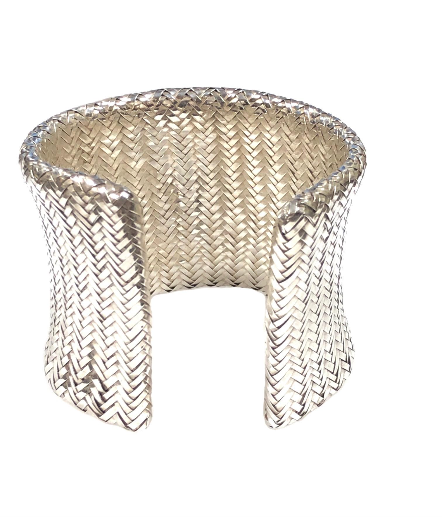 Circa 1980s Angela Cummings Sterling Silver Woven Mesh Cuff Bracelet. Measuring 2 Inches wide with an opening of 7/8 inches, a bit flexible to fit most any wrist, approximate inside measurement 7 inches. Comes in original Angela Cummings box, this