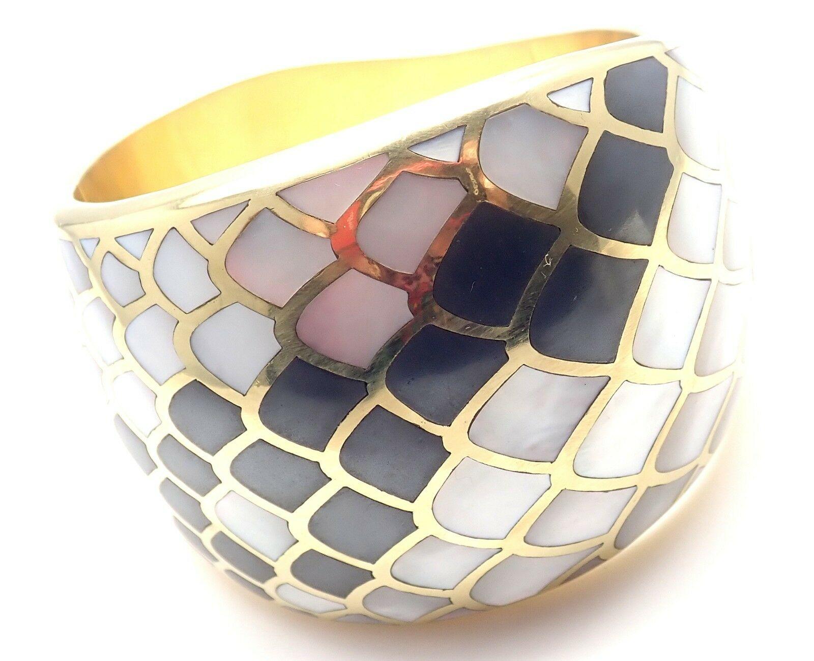 18k Yellow Gold Inlaid Mother Of Pearl Snakeskin Wide Bangle Bracelet by Angela Cummings. 
Circa 1984.
With inlaid mother of pearl to resemble snakeskin.
Details: 
Weight: 121.2 grams
Length: 7