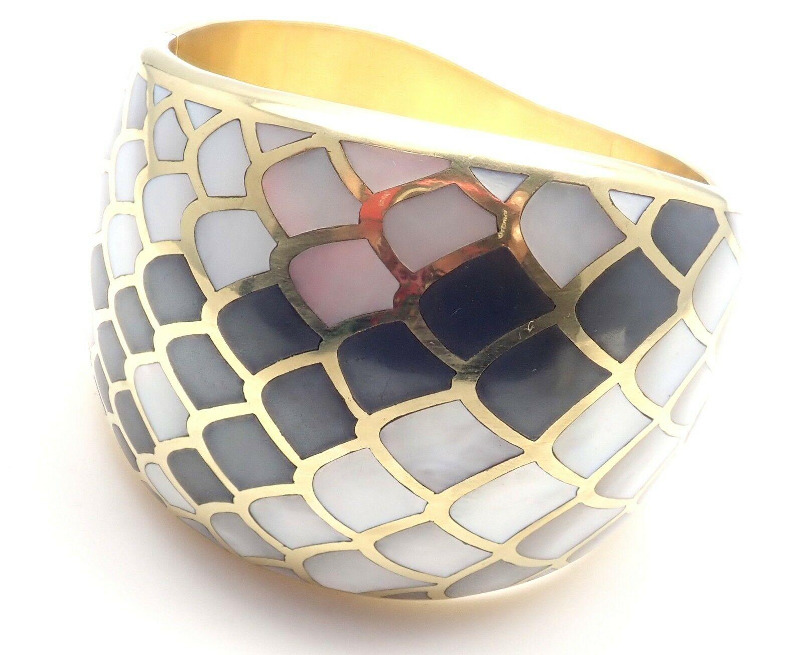 18k Yellow Gold Inlaid Mother Of Pearl Snakeskin Wide Bangle Bracelet by Angela Cummings. 
Circa 1984.
With inlaid mother of pearl to resemble snakeskin.
Details: 
Weight: 121.2 grams
Length: 7