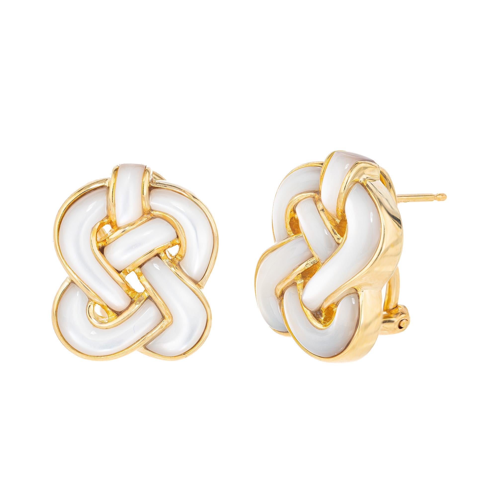 Stunning knot shaped earrings with free formed mother of pearl in 18k yellow gold by jewelry maker Angela Cummings. The earrings feature a post and secure clip to keep in place. These earrings showcase the perfect blend of traditional craftsmanship
