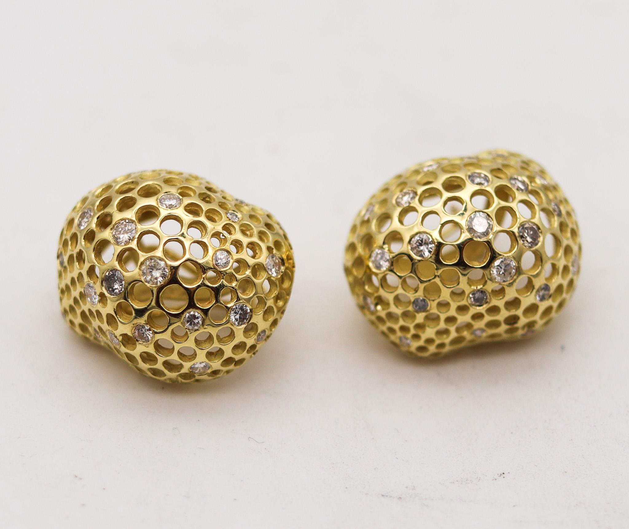 Pair of Perforations earrings designed by Angela Cummings.

Beautiful organic pair, created in New York city by Angela Cummings back in the early 1980's. These modernist Perforations free-form earrings has been crafted in solid yellow gold of 18