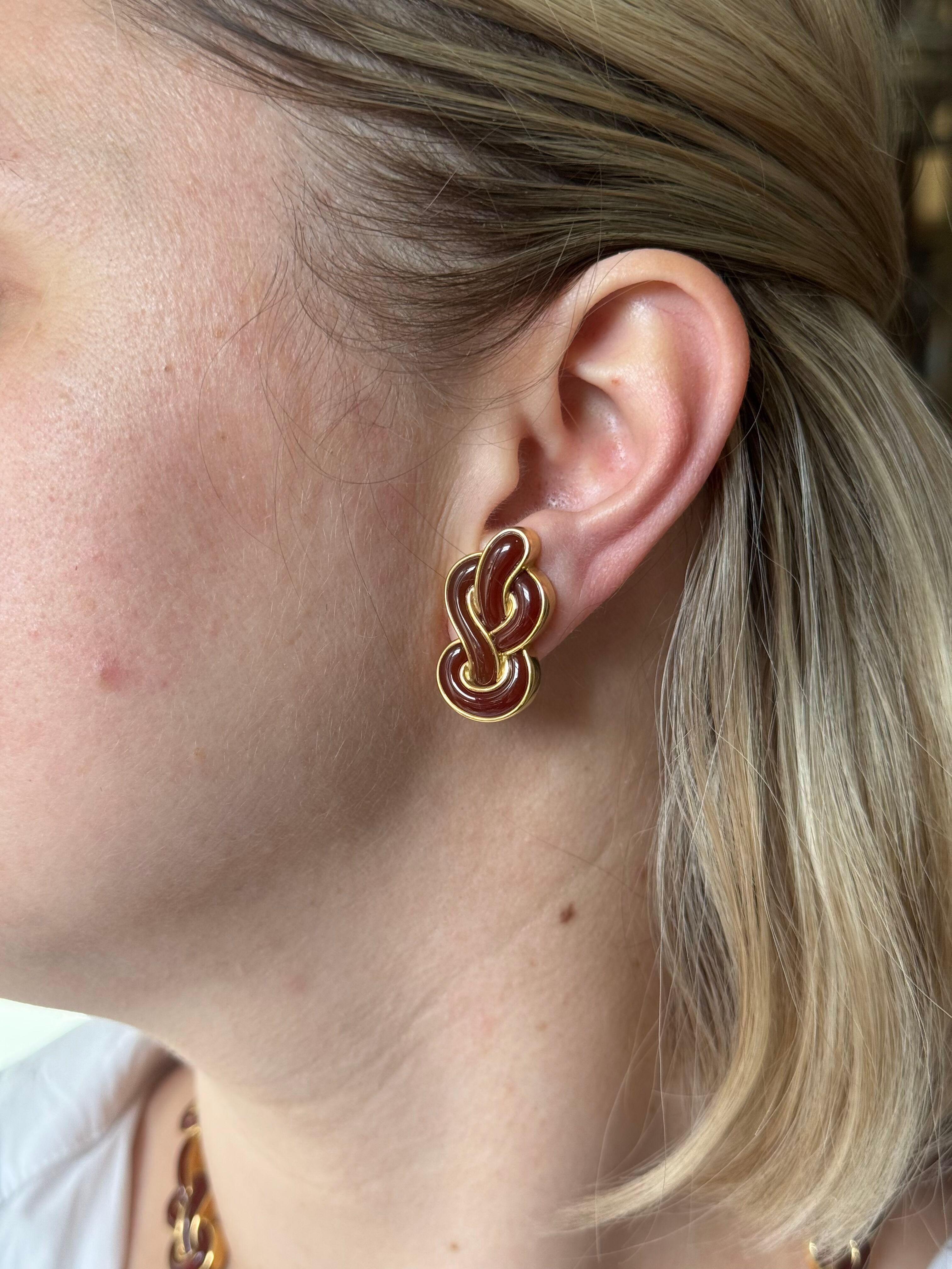 Pair of 18k yellow gold sailor's knot earrings by Angela Cummings, with carnelian. Earrings are 30mm x 18mm. Marked:  Angela Cummings, 750. Weight - 26.2 grams. 