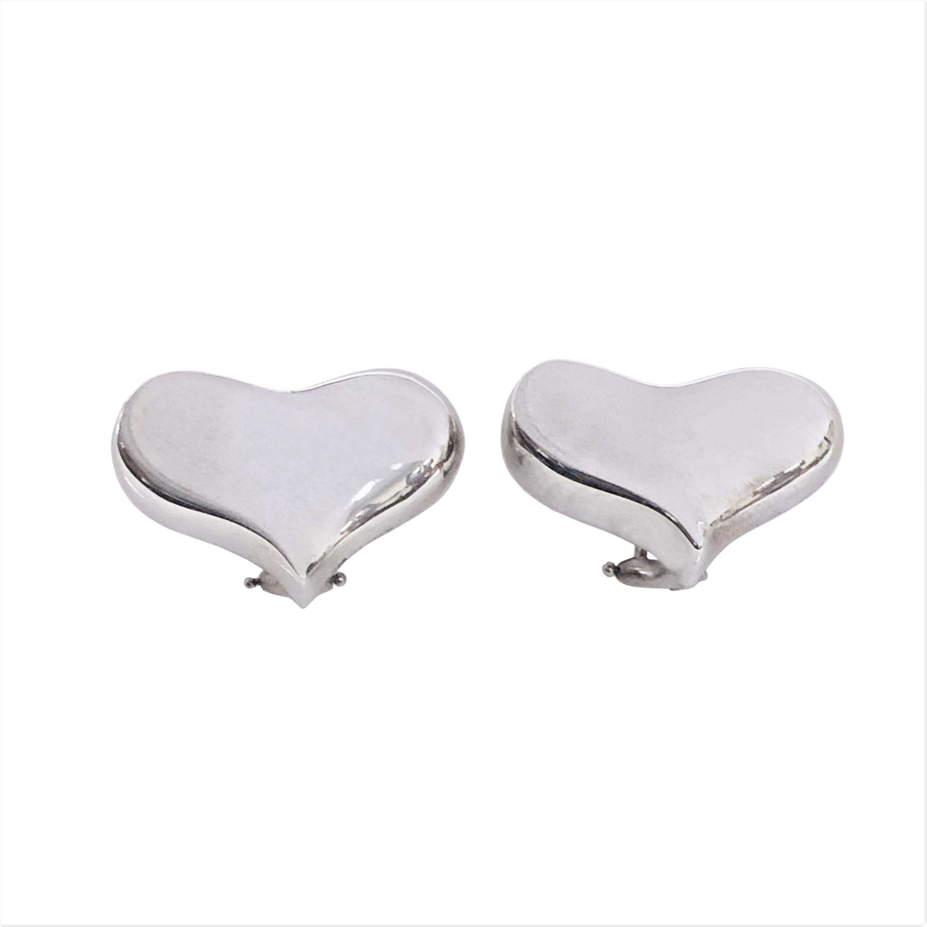 Circa 1980s Angela Cummings Sterling Silver Heart Earrings, measuring 1 X 5/8 inch, having Omega Clip Backs a with a Post. Comes in Original Felt travel pouch. Excellent near unworn condition. 