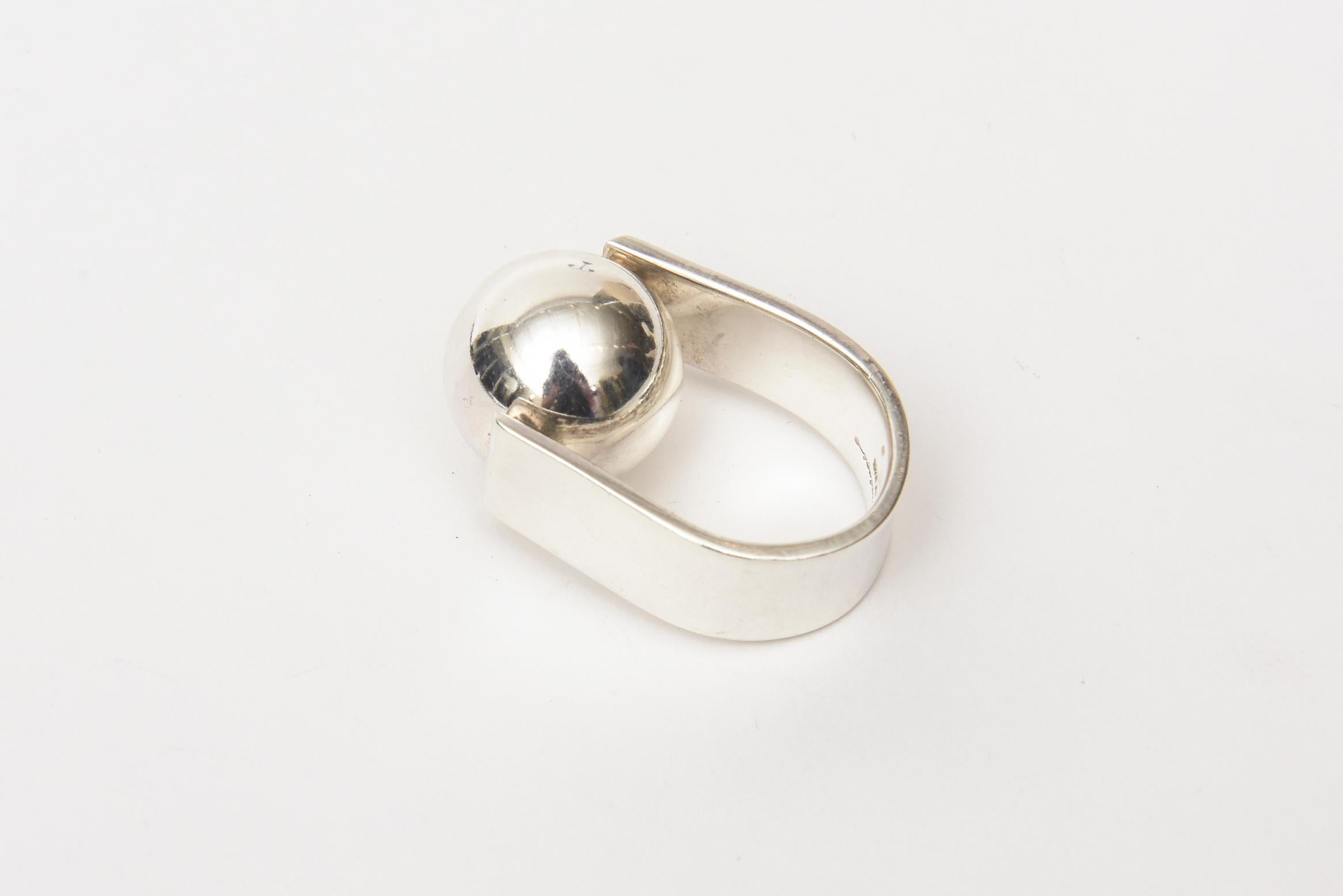 This very special sterling silver vintage hallmarked Angela Cummings ball ring is like a piece of sculpture on the finger. The ball moves. This is more on the rare side now. It fits a size 6 finger. Hallmarked. It is both modern and modernist. it