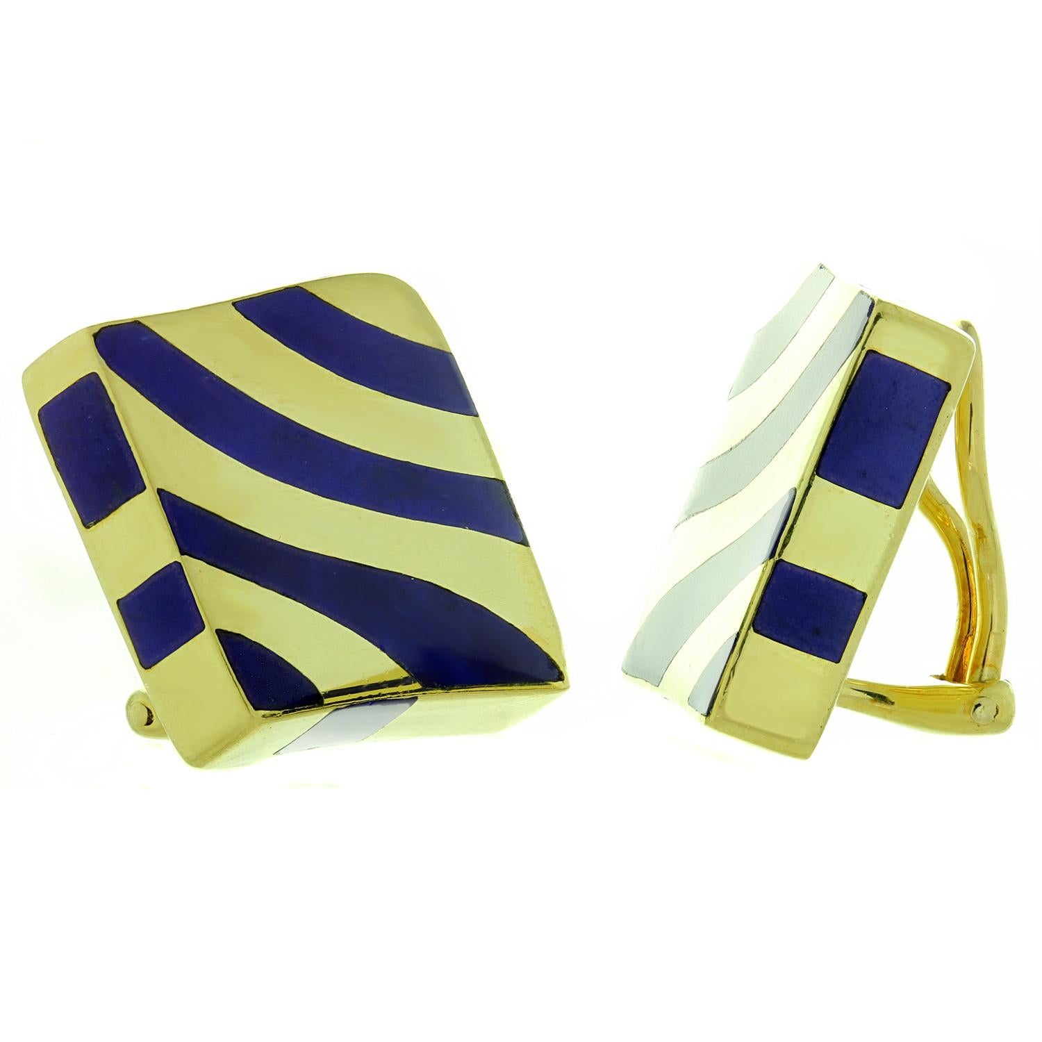 These rare Angela Cummings clip-on earrings earrings are crafted in 18k yellow gold and feature chic blue lapis lazuli stripes. Made in United States circa 1990s. Measurements: 0.78