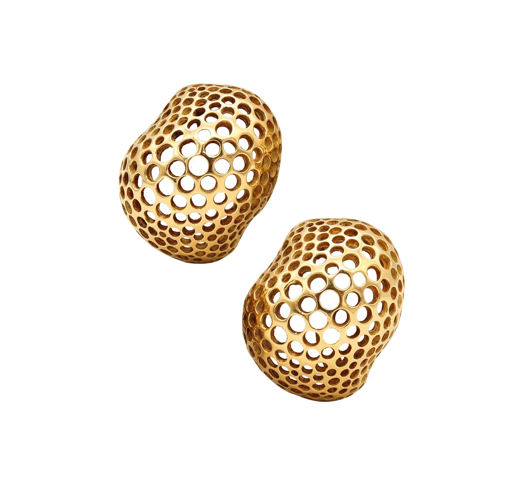 Pair of Perforations earrings designed by Angela Cummings.

Beautiful organic pair, created by Angela Cummings back in the early 1980's. These modernist Perforations free-form earrings has been crafted in solid yellow gold of 18 karats, with semi
