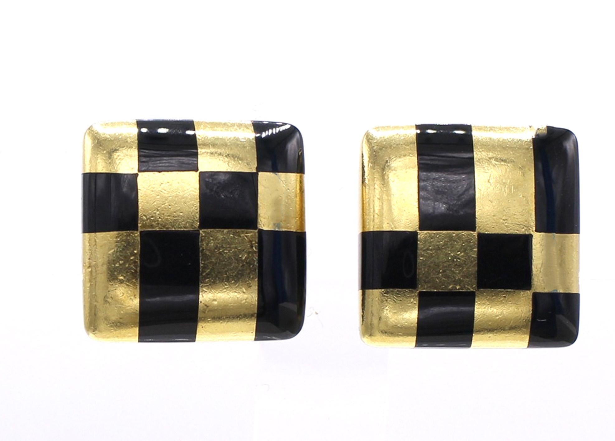 These chic and most wearable ear clips by Angela Cummings for Tiffany truly compliment every ear. Designed in a checker board with polished black jade inlay worked in 18 karat yellow gold, these ear clips have the perfect weight for an every-day