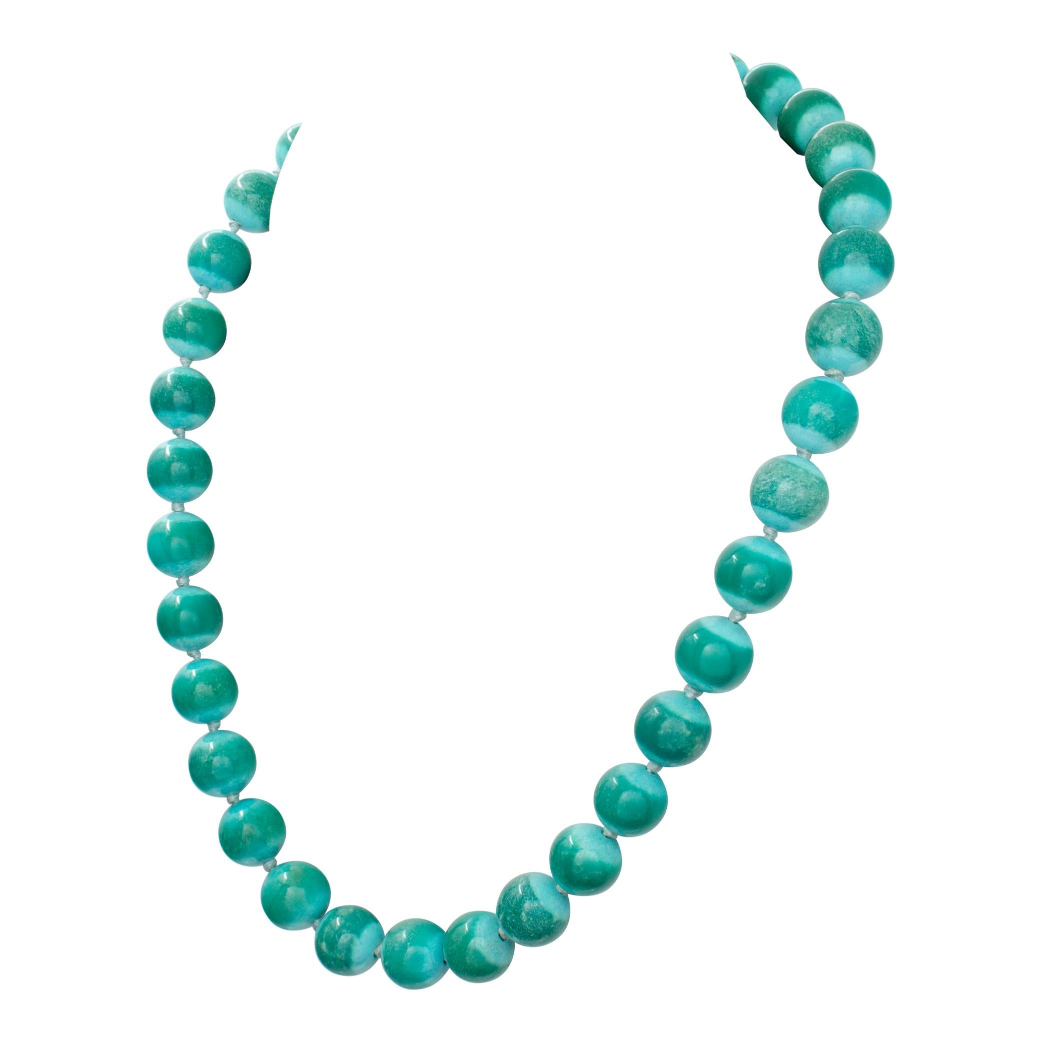 Angela Cummings Turquoise Bead Necklace with 18k clasp, 33 beads measure 11.7-12.1 mm, clasp signed CUMMINGS, 1993. Lengt 19 inches.
