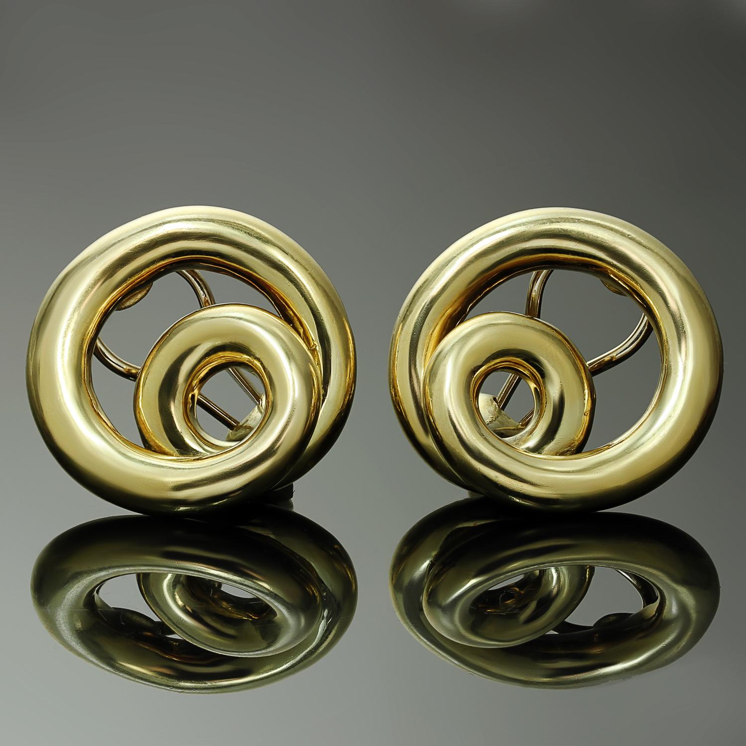 These gorgeous vintage earrings by Angela Cummings are crafted in 18k yellow gold and feature a 3-dimensional coiled swirling design completed with clip-on backs. Posts can be added upon request. Made in United States circa 1990s.  Measurements: