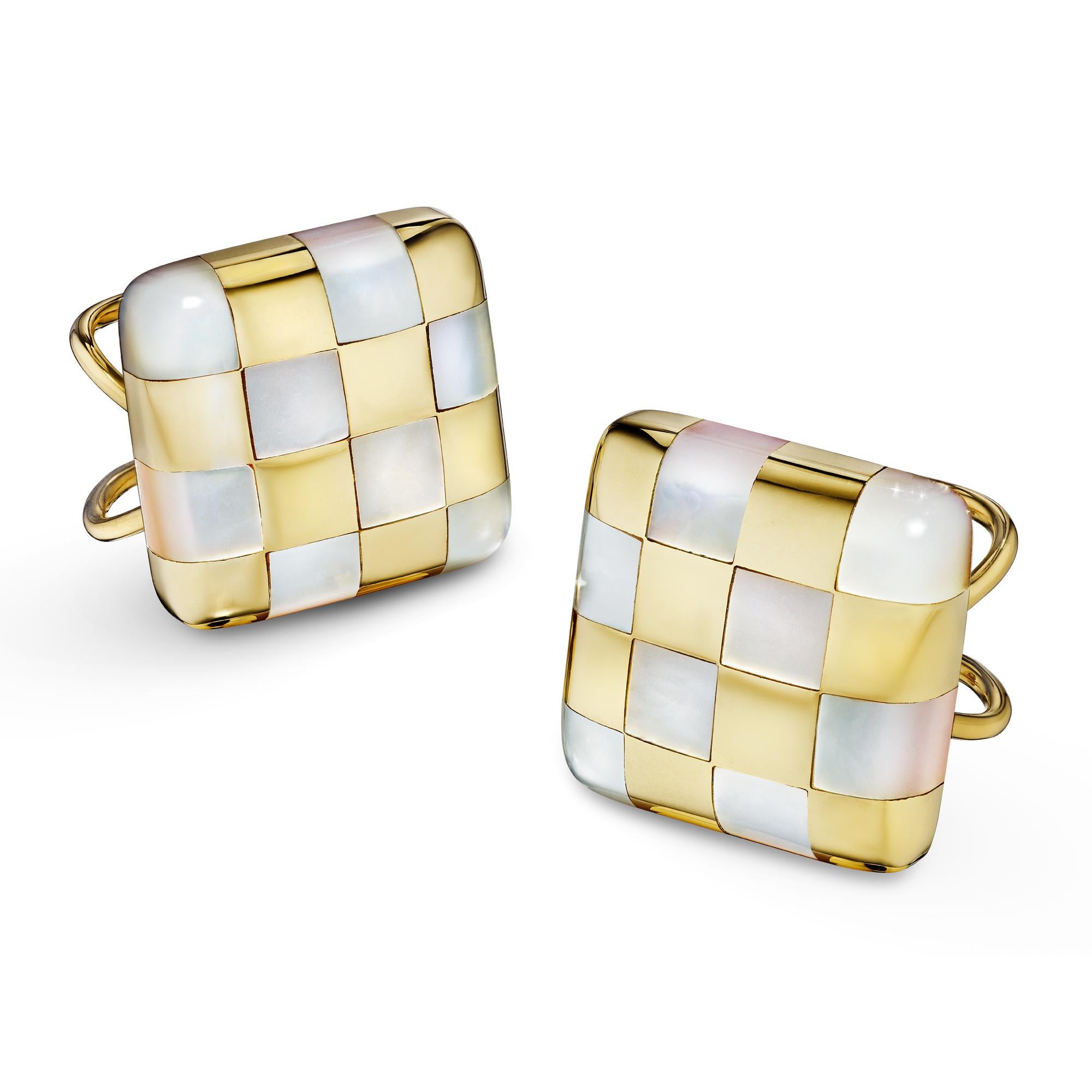 Play checkers with these chic Angela Cummings vintage mother-of-pearl and gold earrings.  With an alternating pattern of square cut mother-of-pearl and 18 karat yellow gold, these handmade and collectible earrings are a sure game changer.  Signed