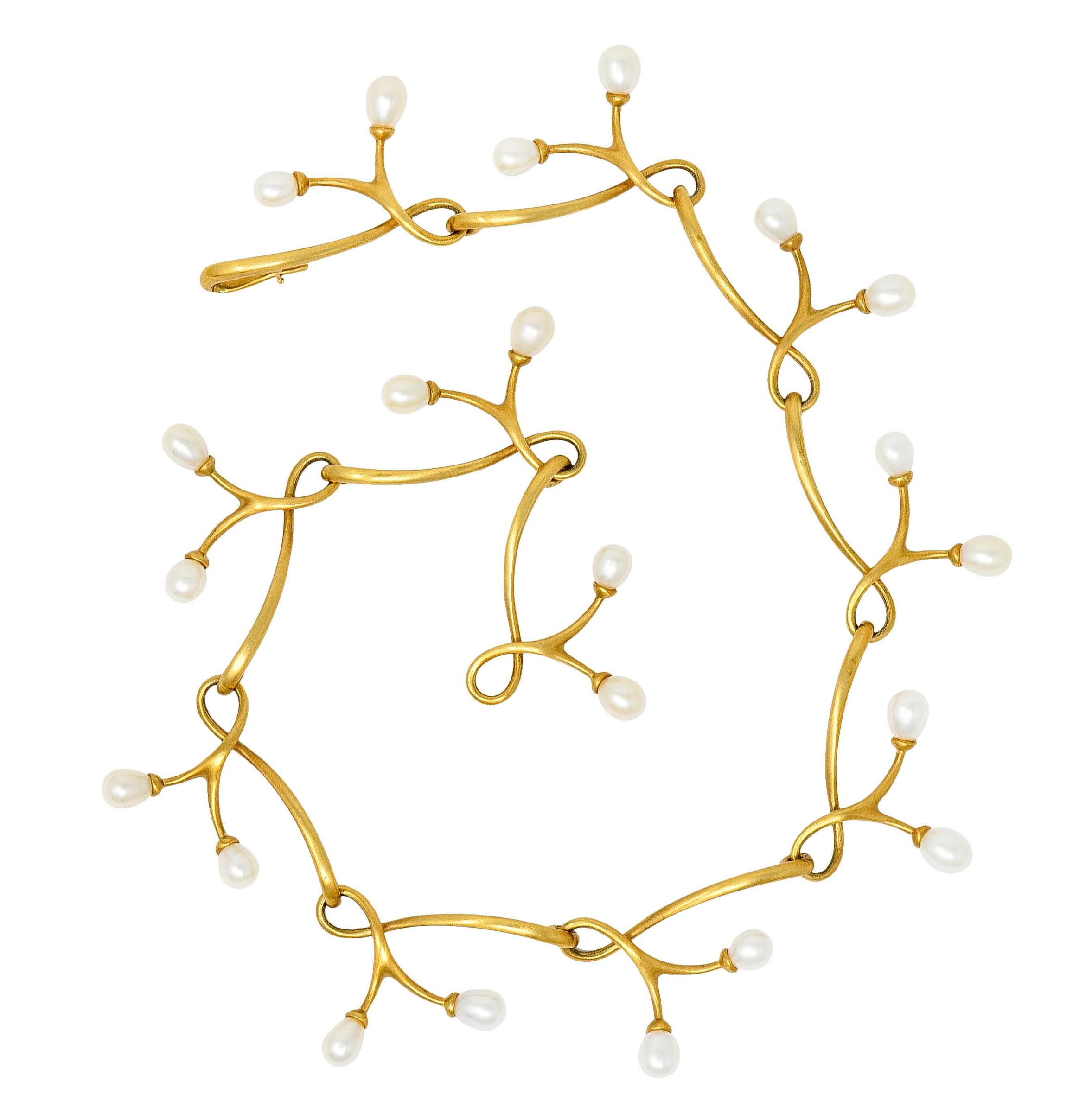 Collar necklace is comprised of twisting vine-like links - matte gold

Accented throughout by pampel shaped pearls measuring approximately 7.5 x 6.5 mm

Very well matched in white body color, some with rosé overtones, and all with excellent
