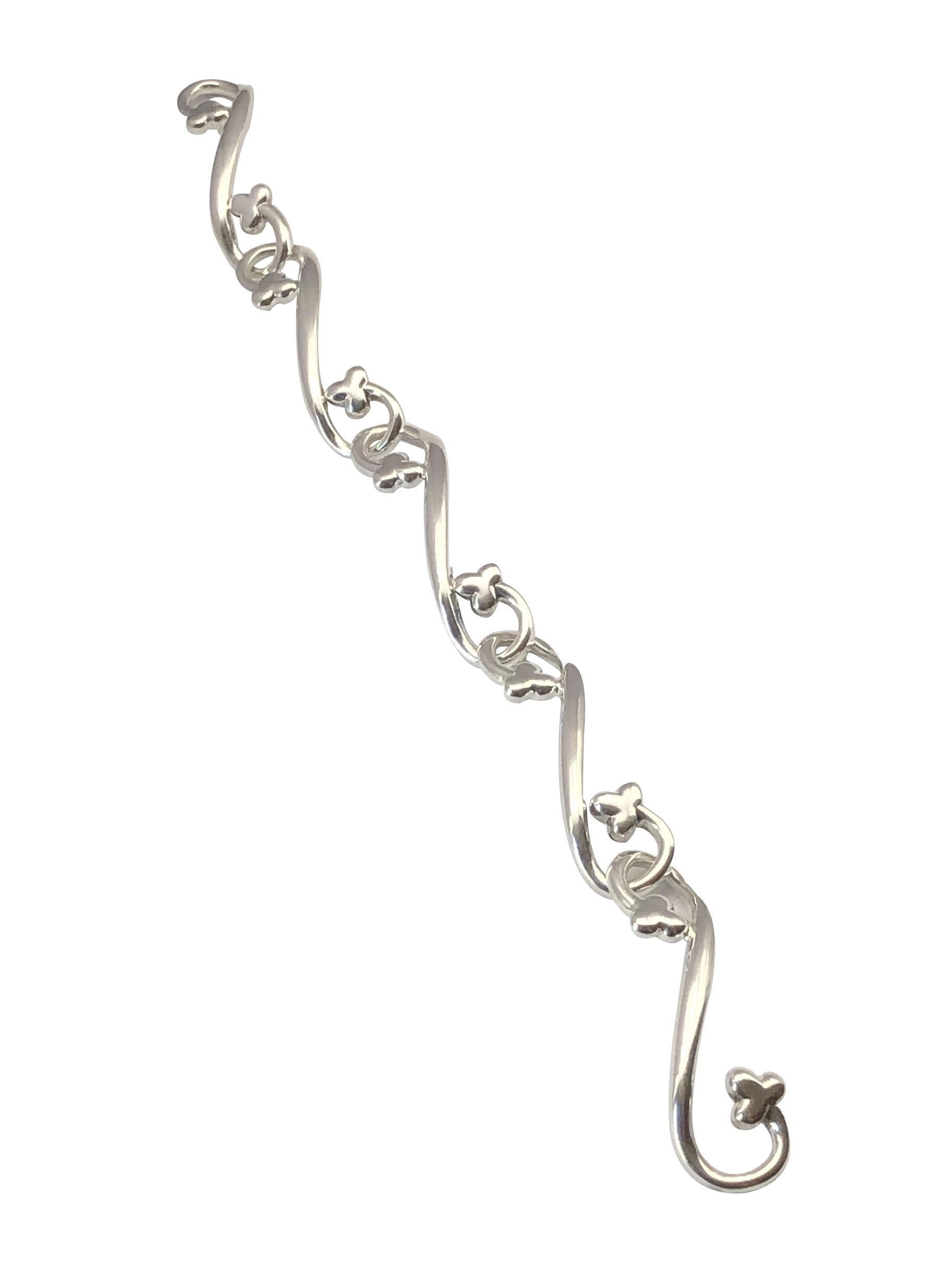 Circa 1987 Angela Cummings Sterling Silver Bracelet, comprised of long solid bar links curved at each end with a Clover, bracelet length 8 inches, this Cummings piece dates from just before her famous association with Tiffany & Company with many of