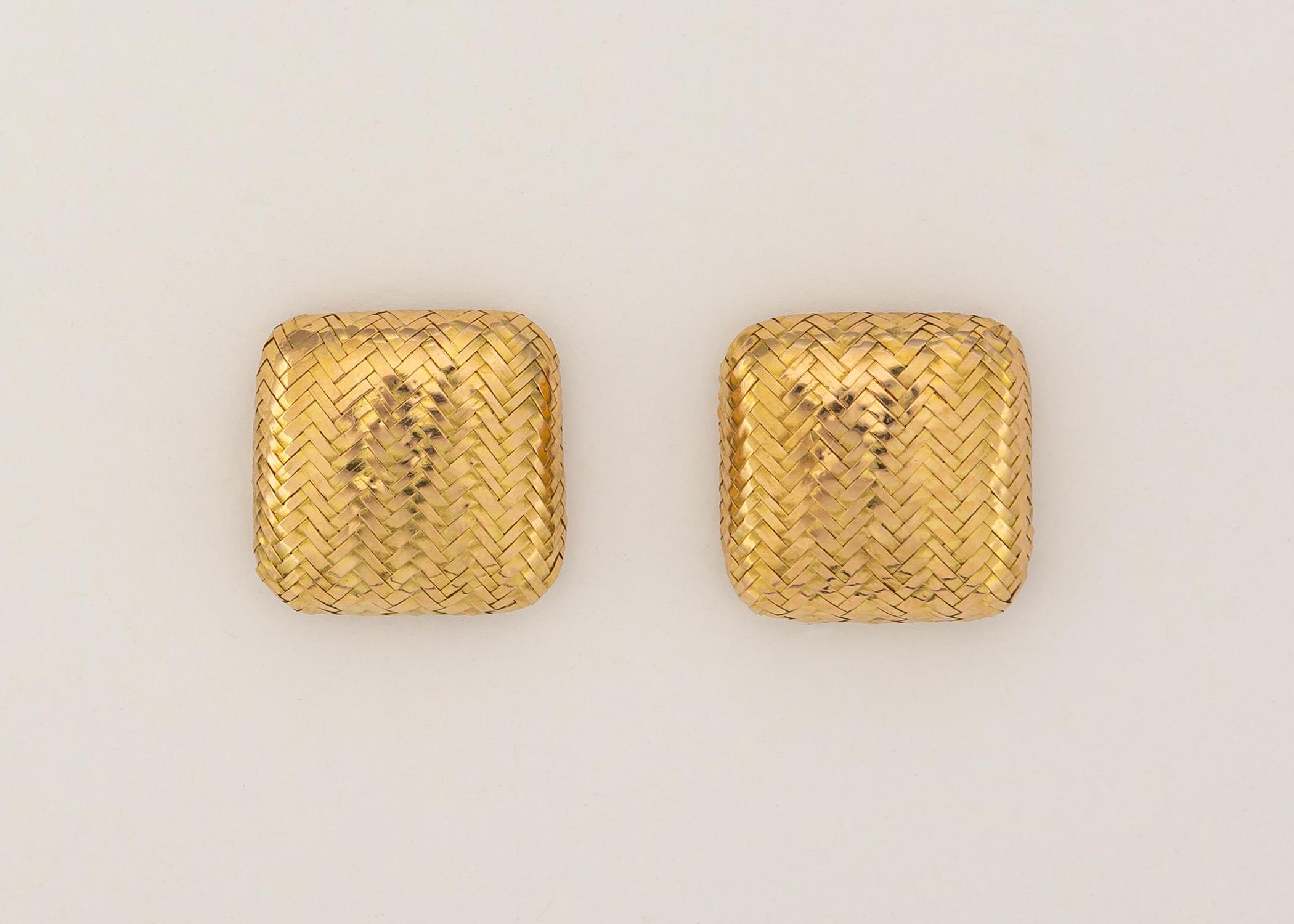 Angela Cummings began her career under the Tiffany & Co. umbrella before founding her own company. Angela Cummings creates a basic easy to wear gold earring but makes it unique with woven gold strands. Approximately 3/4's of an inch in size.