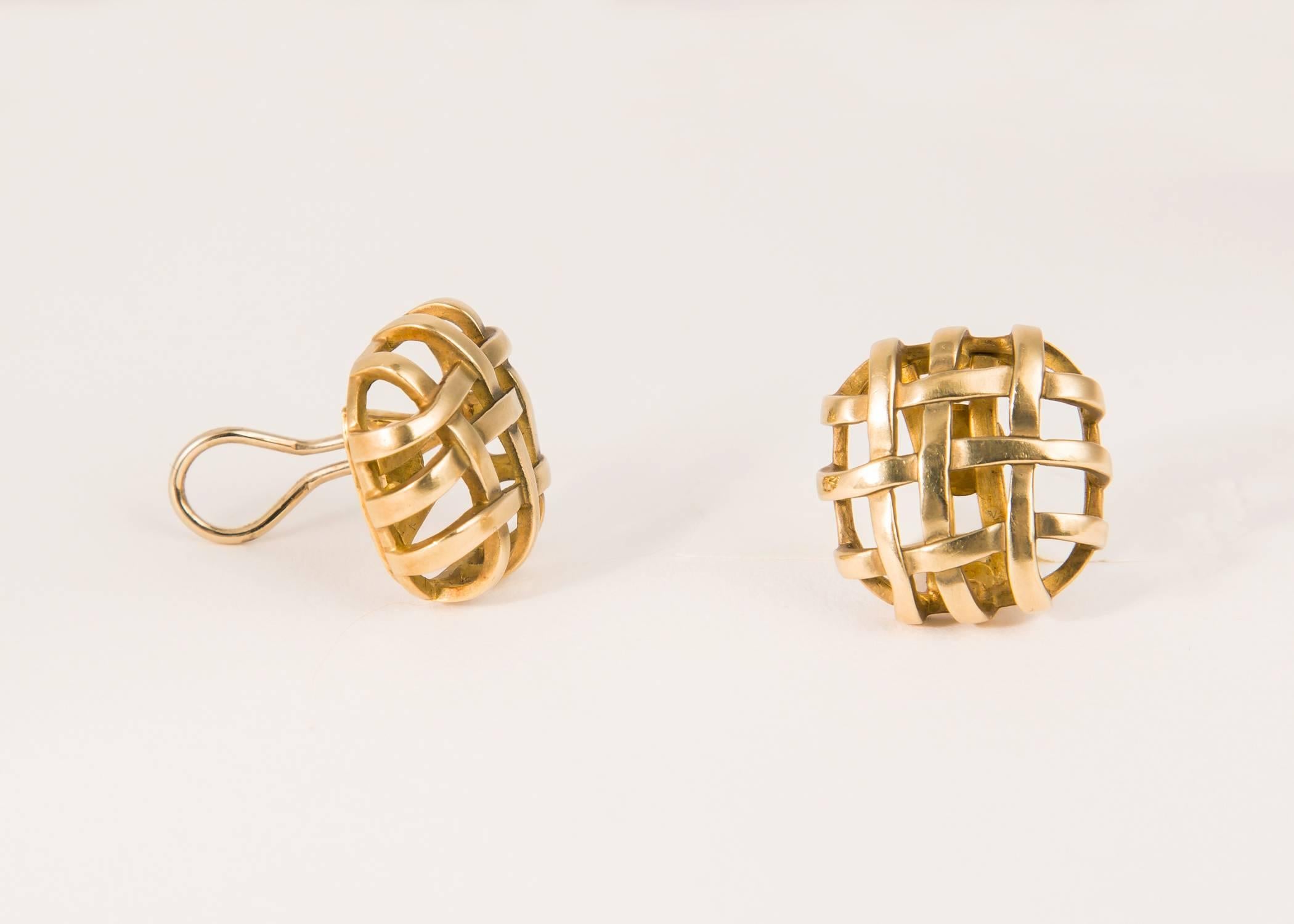 Angela Cummings creates a classic easy to wear earring with simple woven ribbons of gold. 3/4's of an inch in size.