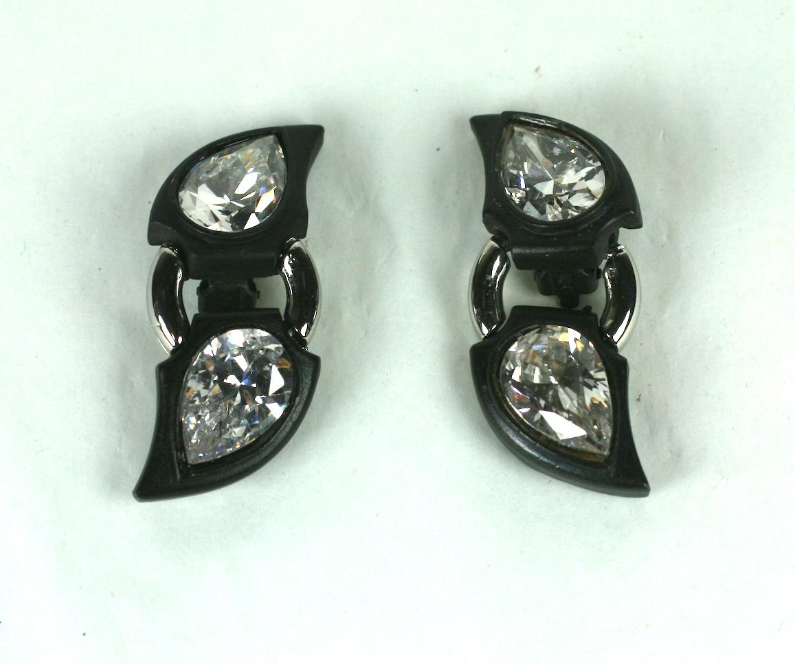 Angela Kramer Blackened Metal Earrings from the 1990's with huge pear shaped CZ's. Motifs are articulated to move with wearer. 
Her designs were always extremely bold and unusual. Clip back fittings.
2