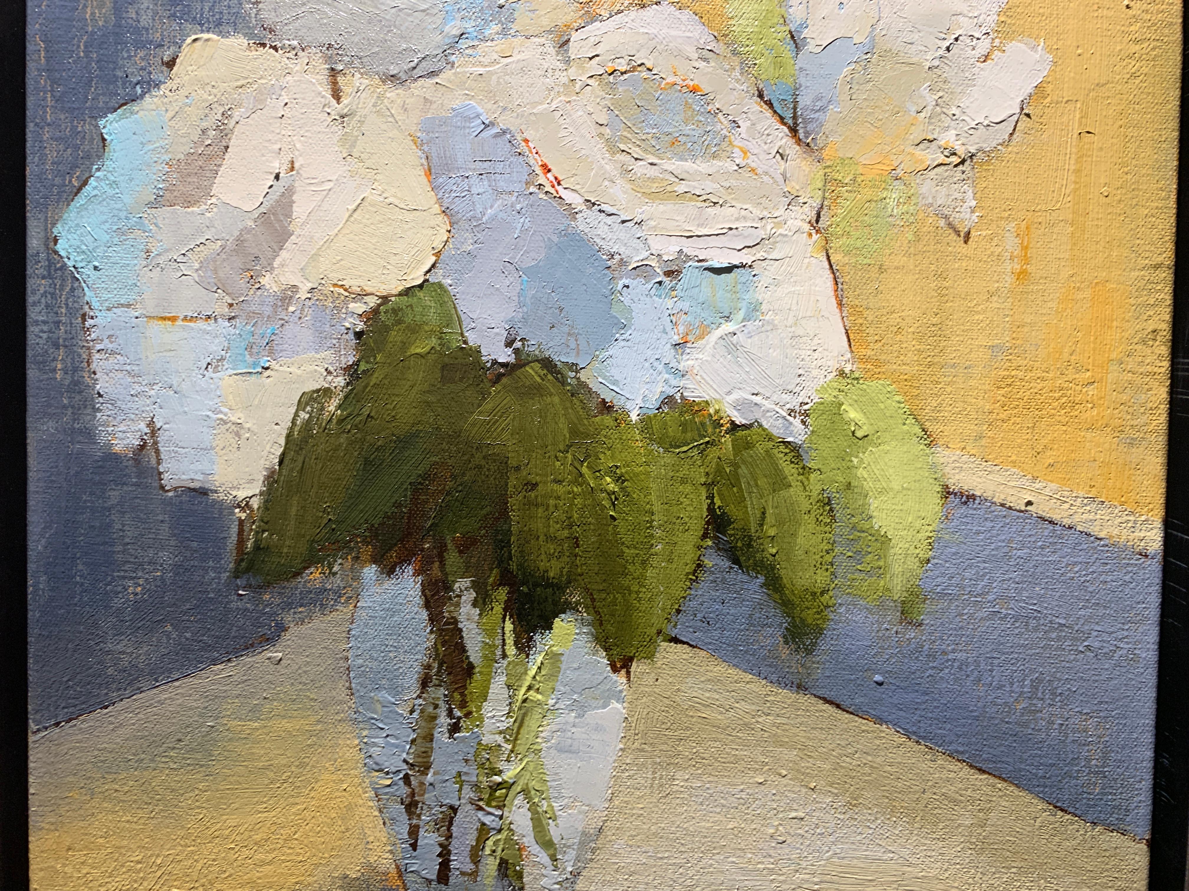 This petite impressionist 2019 painting from American artist Angela Nesbit depicts white flowers in a glass vase.  White, blue, grey and yellow can be found in the soft and subtle palette.  The artist signed this piece on the bottom right. Unframed,