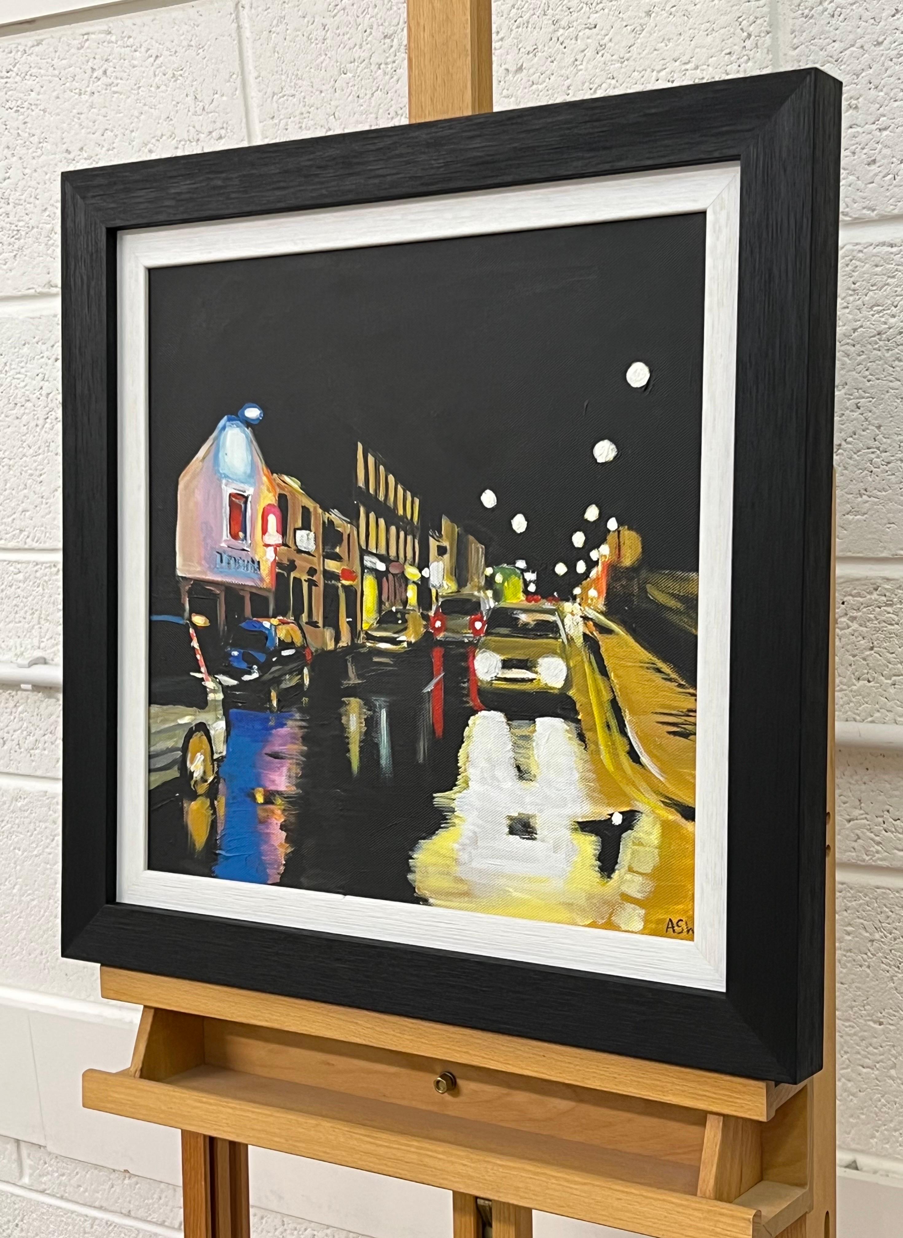 Peinture d'un village du nord de l'Angleterre en hiver, réalisée par Angela Wakefield, grande artiste britannique contemporaine du paysage urbain. Le tableau représente un paysage urbain du village de Whalley, dans le Lancashire, par une soirée