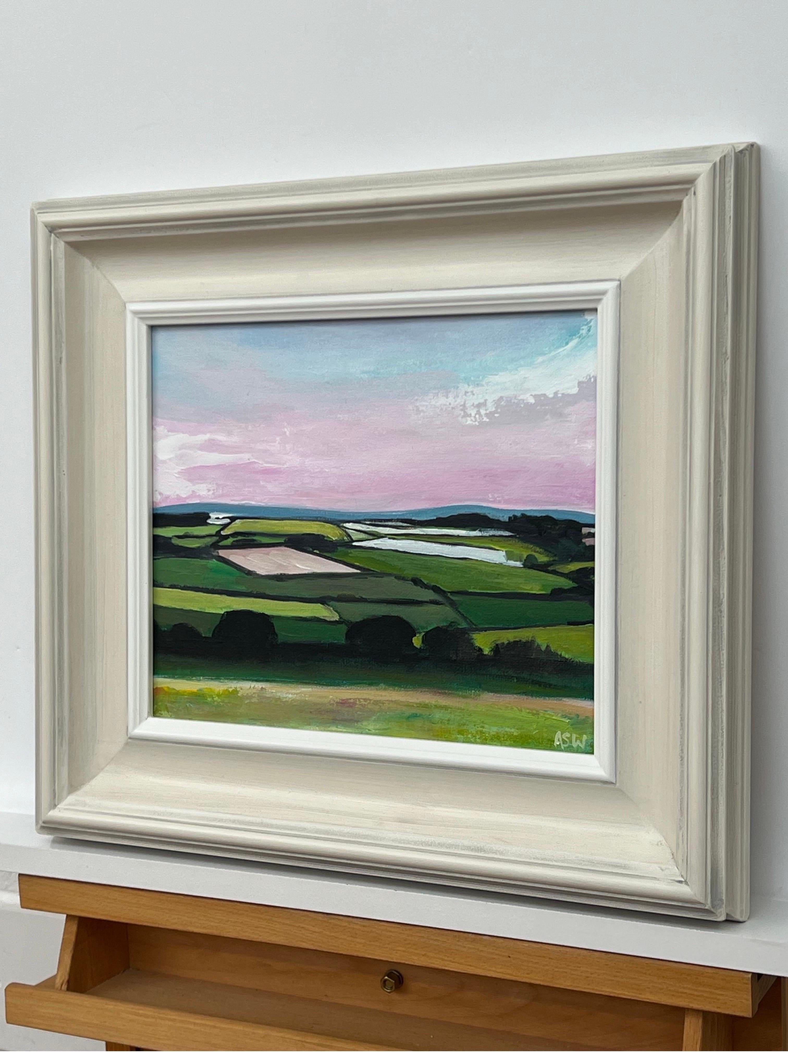 Patchwork quilt of vibrant green pasture, ploughed fields and farmland hedgerows with pink sky at dusk in the English Countryside by Contemporary British Artist, Angela Wakefield. 

Art measures 12 x 10 inches 
Frame measure 18 x 16 inches 

Angela