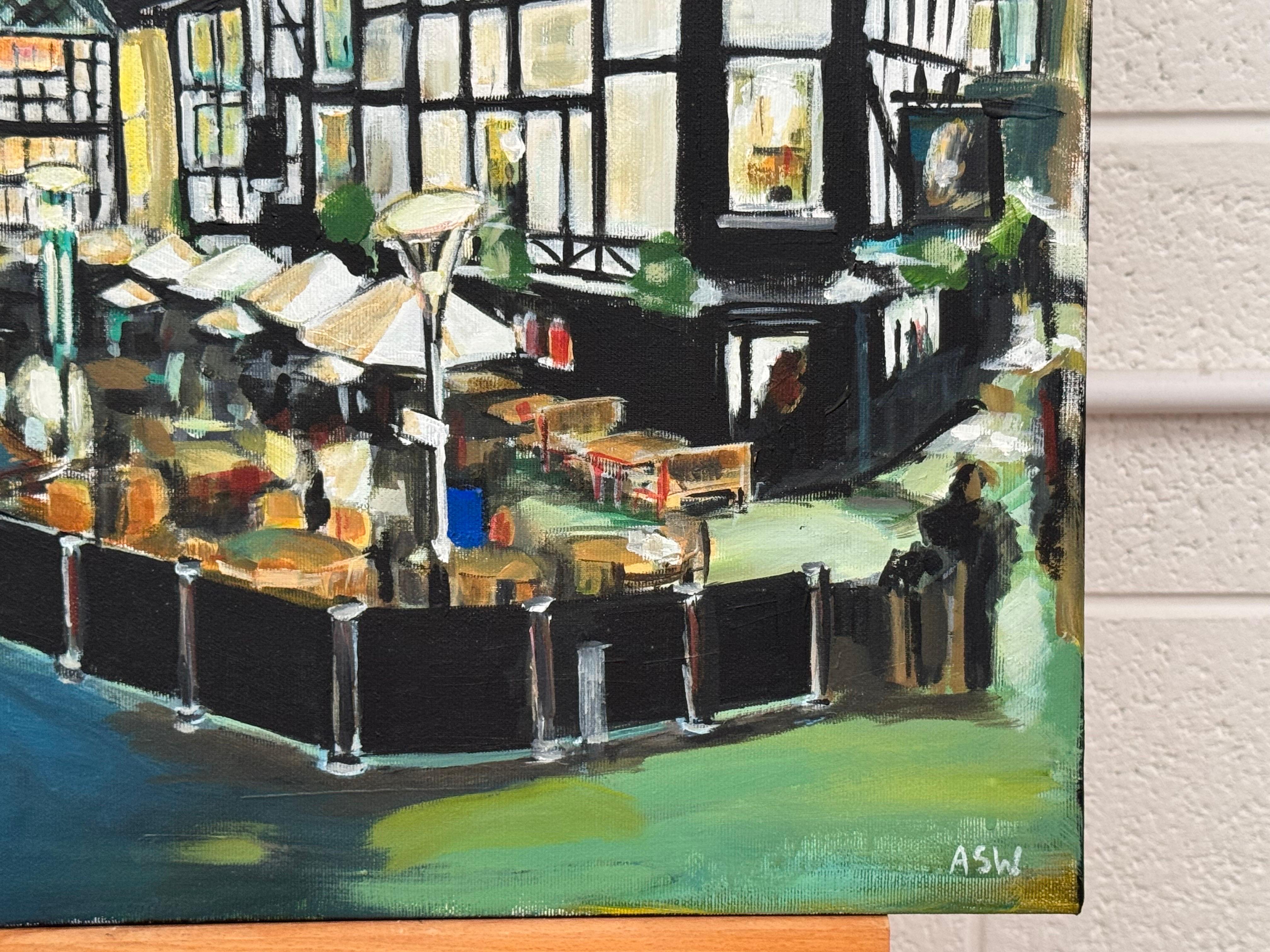 Shambles Square im Stadtzentrum von Manchester bei Nacht von Angela Wakefield, Künstlerin für zeitgenössische Stadtlandschaften

Kunst misst 24 x 24 Zoll (ungerahmt) 
Hochwertiges italienisches Box-Canvas 

Angela Wakefield - Nocturne in Shambles