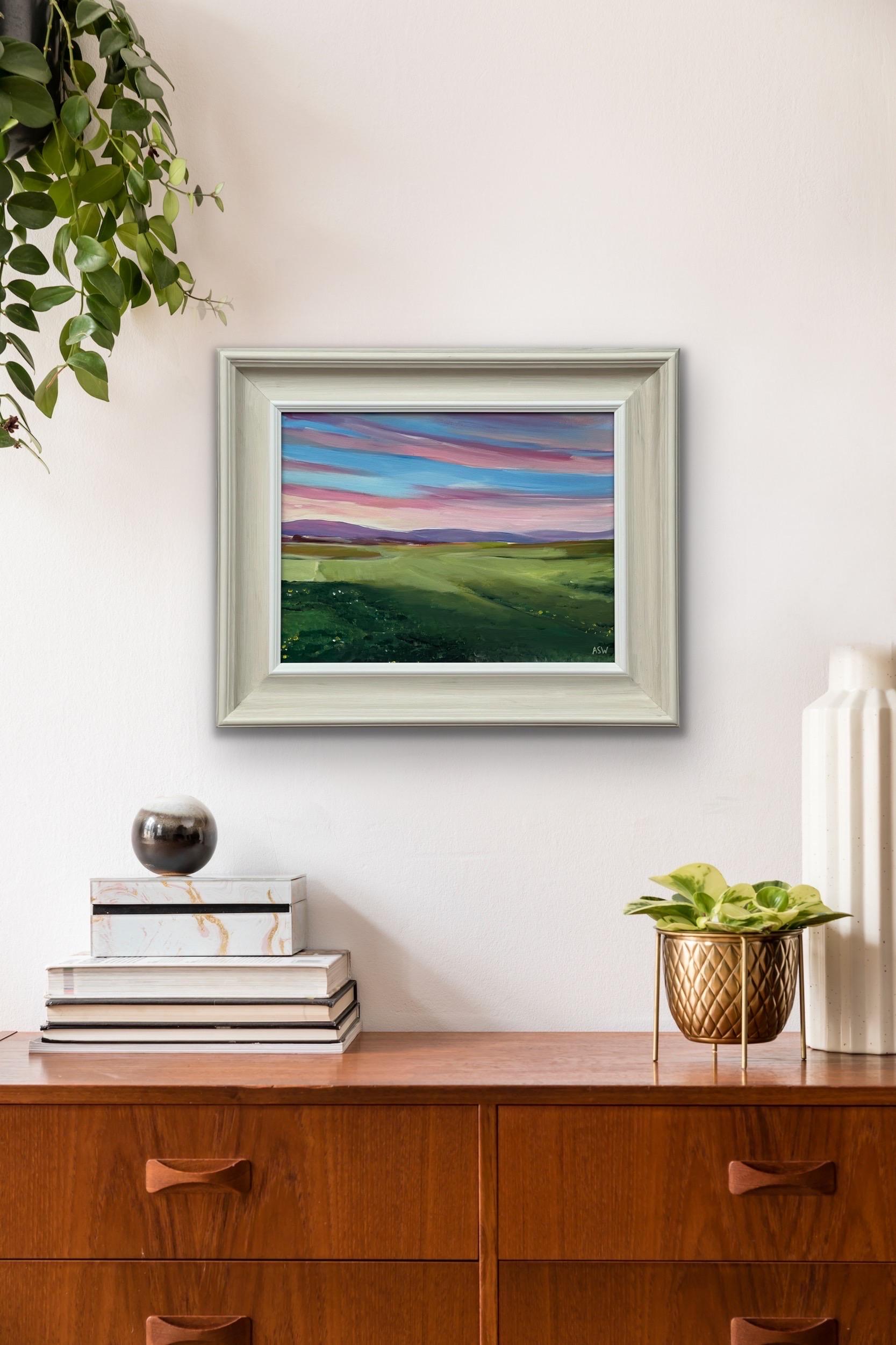 Sunset at Brora Golf Course in the Scottish Highlands by Contemporary British Artist, Angela Wakefield. This unique original depicts a pink & blue sky with purple hills at sunset on the east coast of Scotland. 

Art measures 16 x 12 inches 
Frame