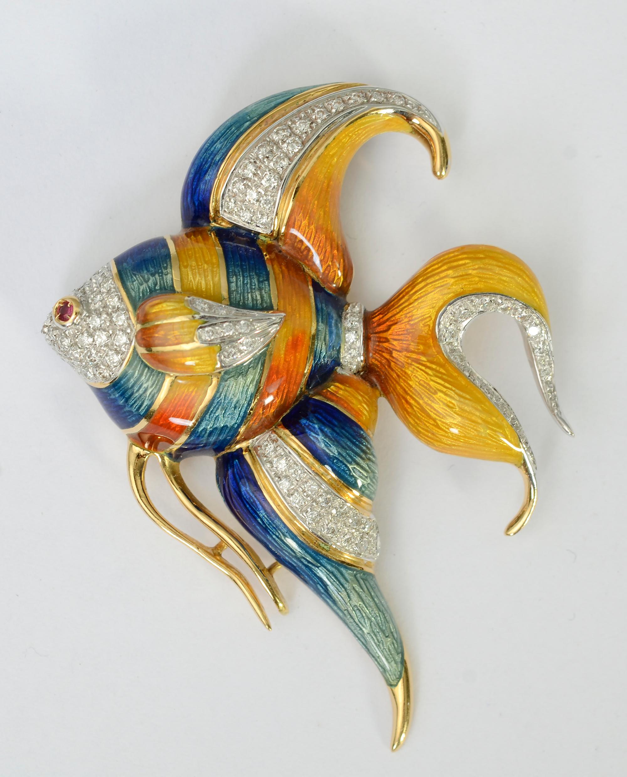 Finely made Angelfish with an  enamel and diamond body and ruby eye. The fish is both a pendant and a brooch, There is wonderful shading to the guilloche enamel. Measurements are 2 inches wide and 2 1/2 inches long.