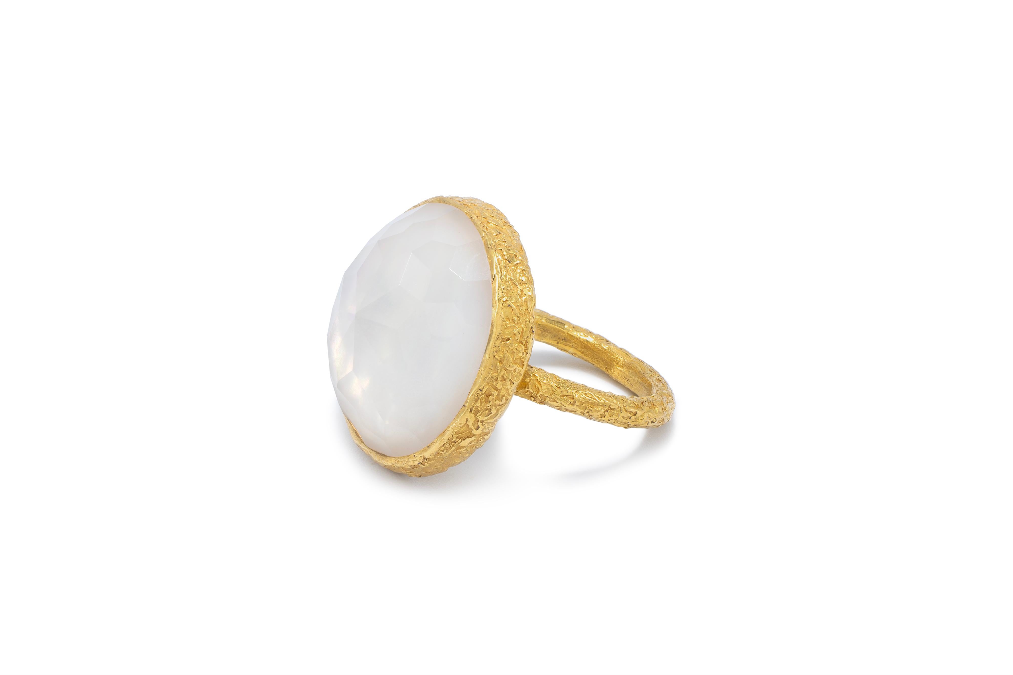 Angelic Pearl and Crystal Cocktail ring is handmade in 22k gold and features Tagili Designs signature finish. The Crystal lays a top the pearl and gives it magical depth and beauty and is part of the Celestial Collection. This collection captures