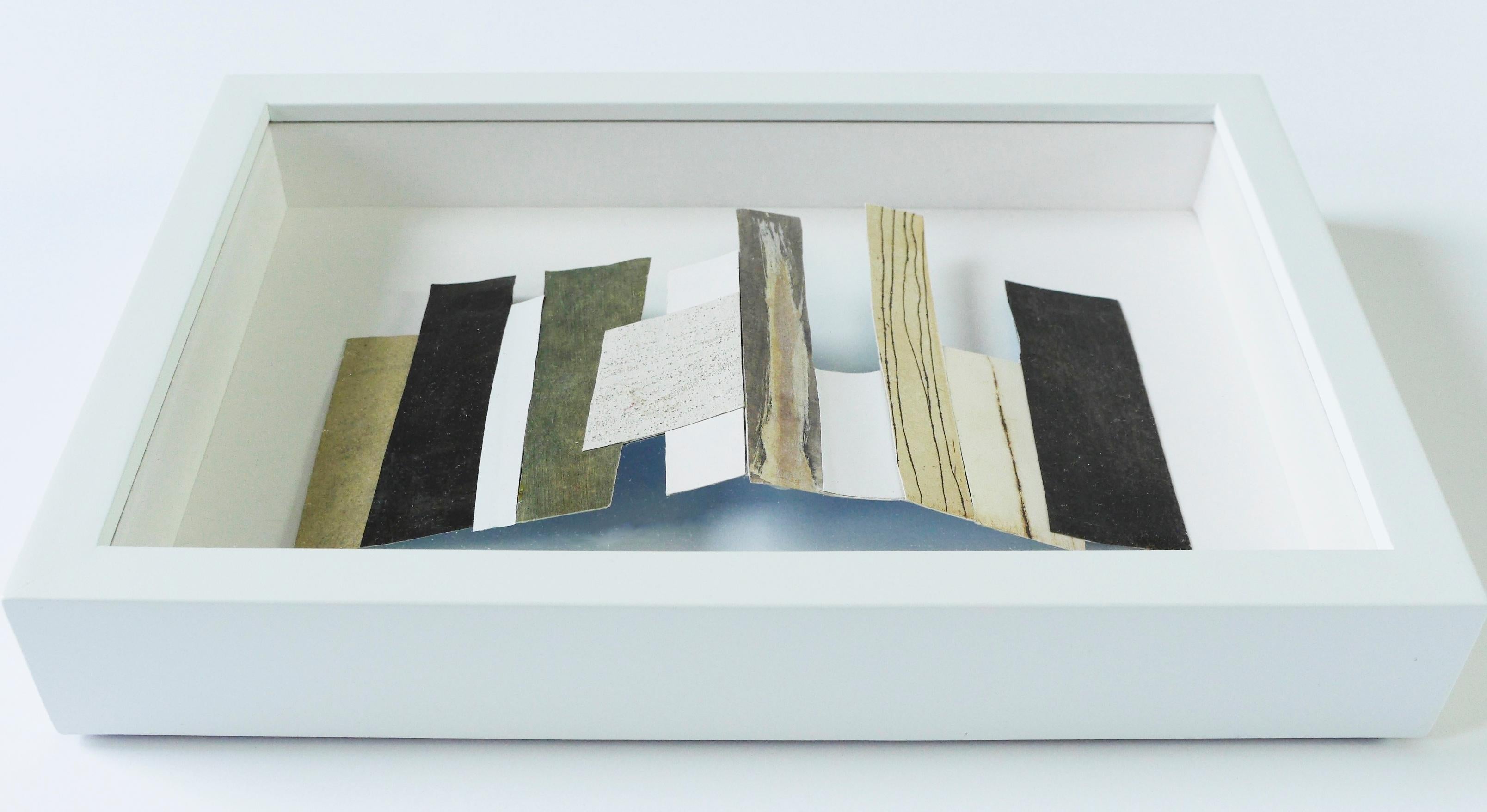 NY #3
2019
collage, recycled paper scraps (acrylic, etching print)
4.6 H x 3 W x 1 D in  11.6 x 7.6 x 2.54 cm – 8 1⁄4 x 6 3⁄4 x 1 3⁄4 in (framed)
(Additional images of other NY 

In honor of Earth Day and all things repurposed, Ground Floor Gallery