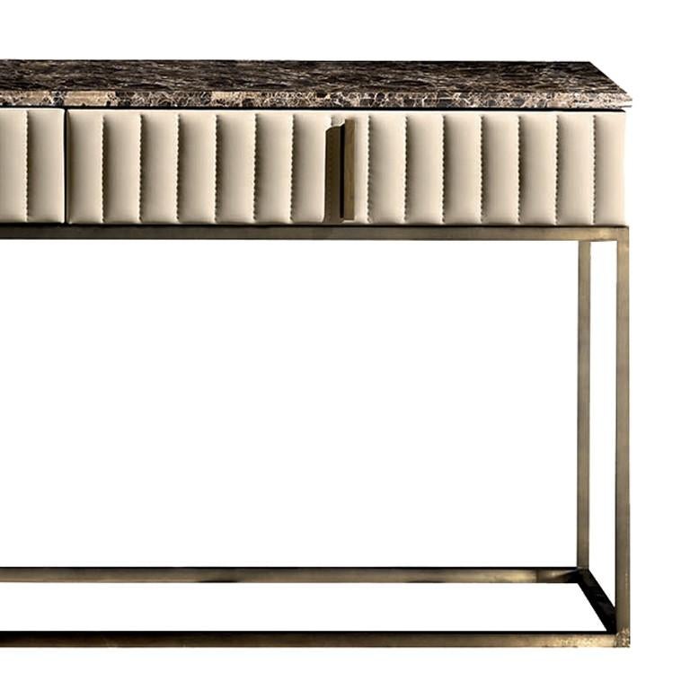 Placed in the living room or in an entryway as a supporting surface for lamps, vases, candle holders, or books, this console is a sure eye-catcher. Made of wood with a myrtle burl veneer and brushed gloss finish, it features two large drawers with